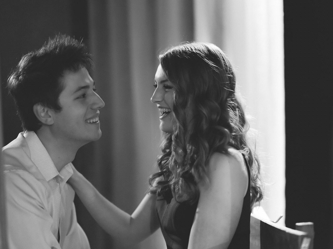 Required black and white photo of couple laughing
