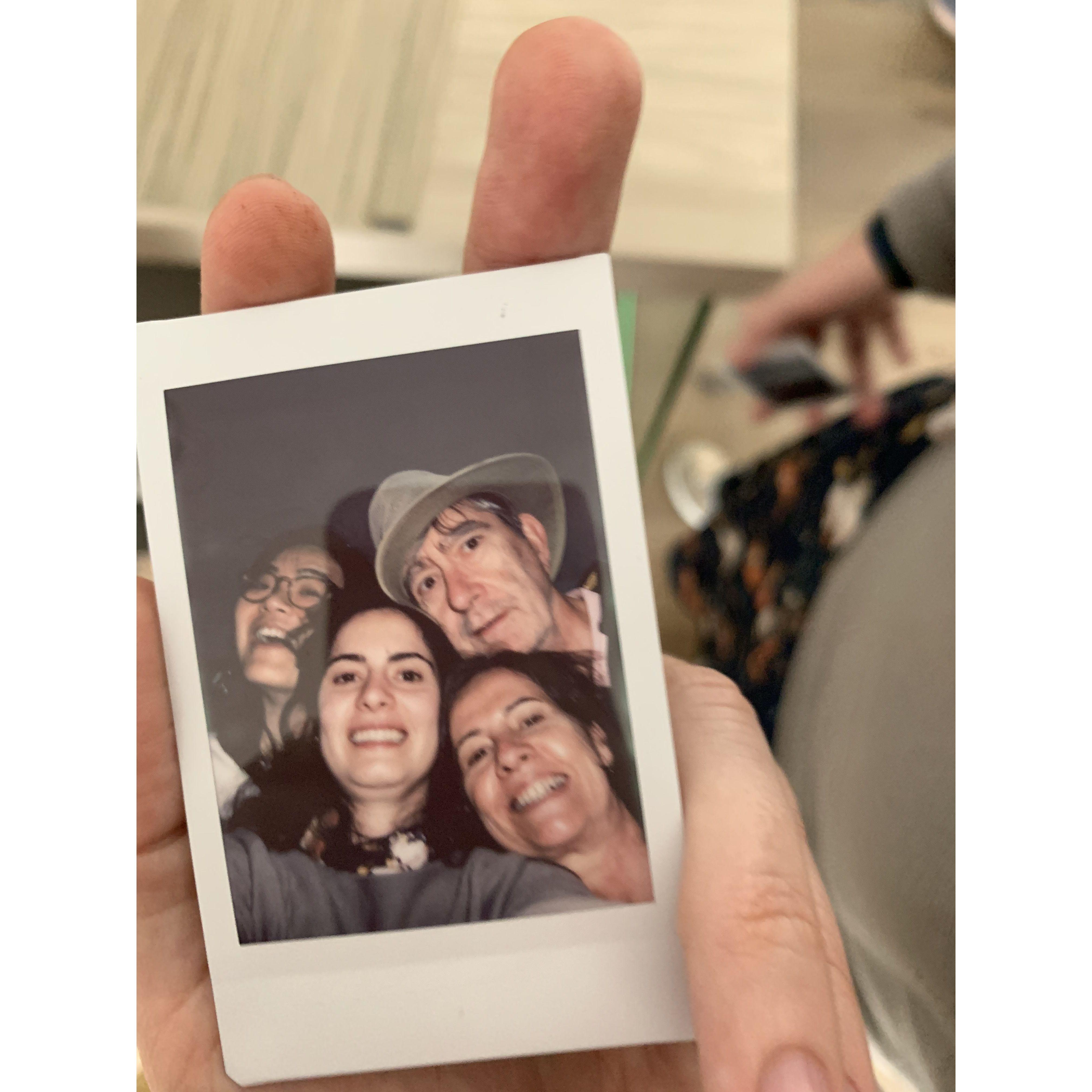 Family picture where everyone tries to squeeze in.