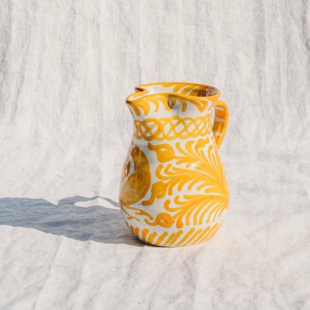 Small pitcher with hand painted designs