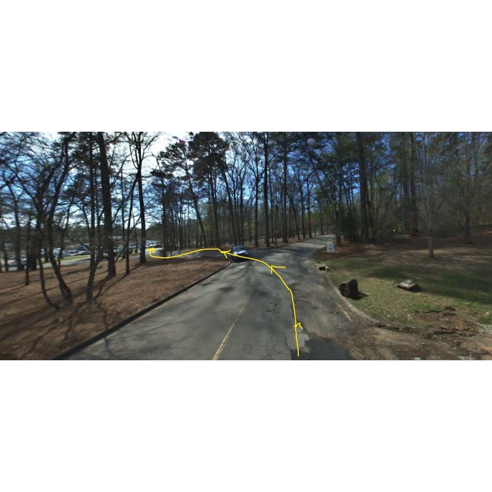 Immediately after turning in from the round-about, keep straight until the path veers to the left, and continue on this path until you reach the main parking lot in front of the Zoo ticket booths.