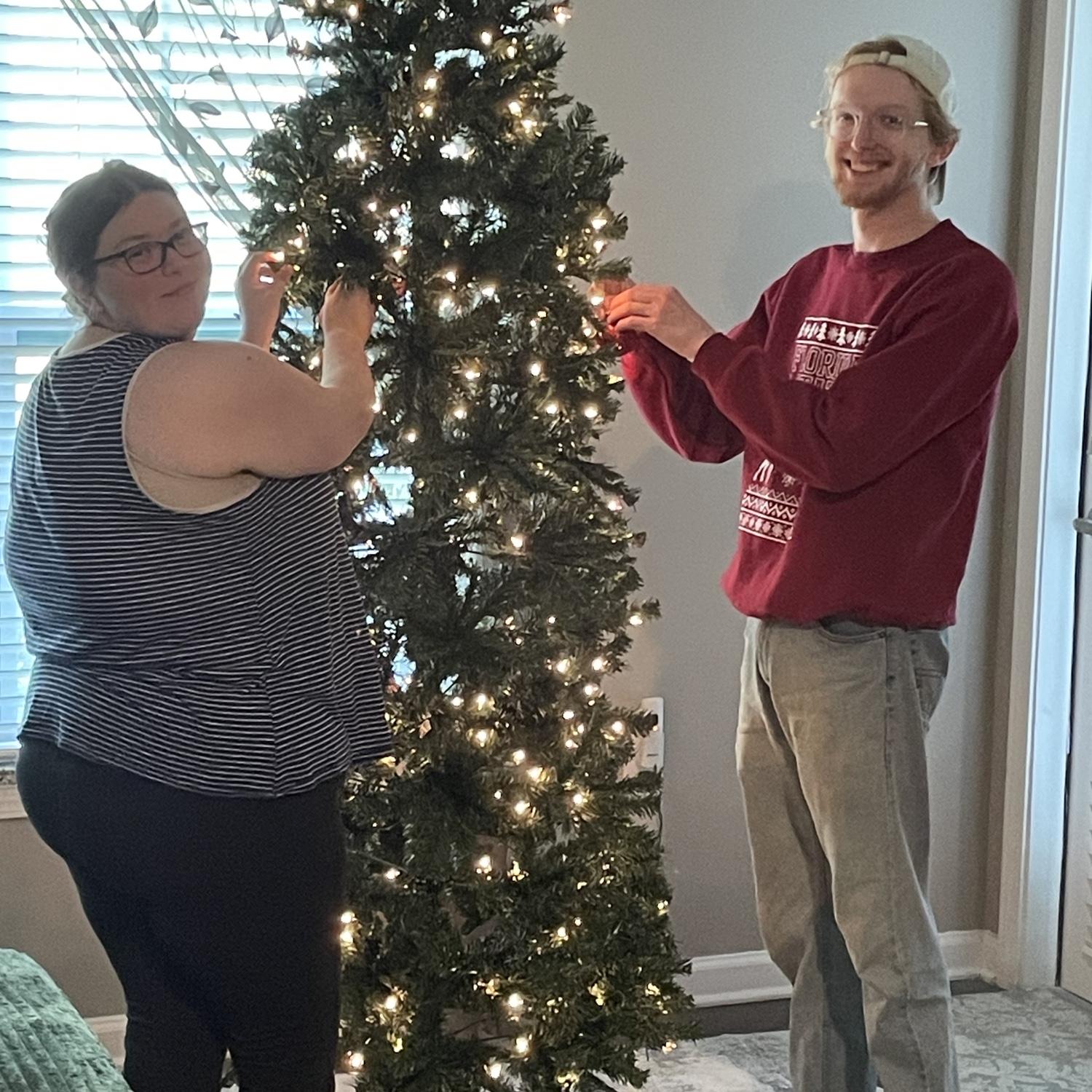 Decorating our first Christmas tree.