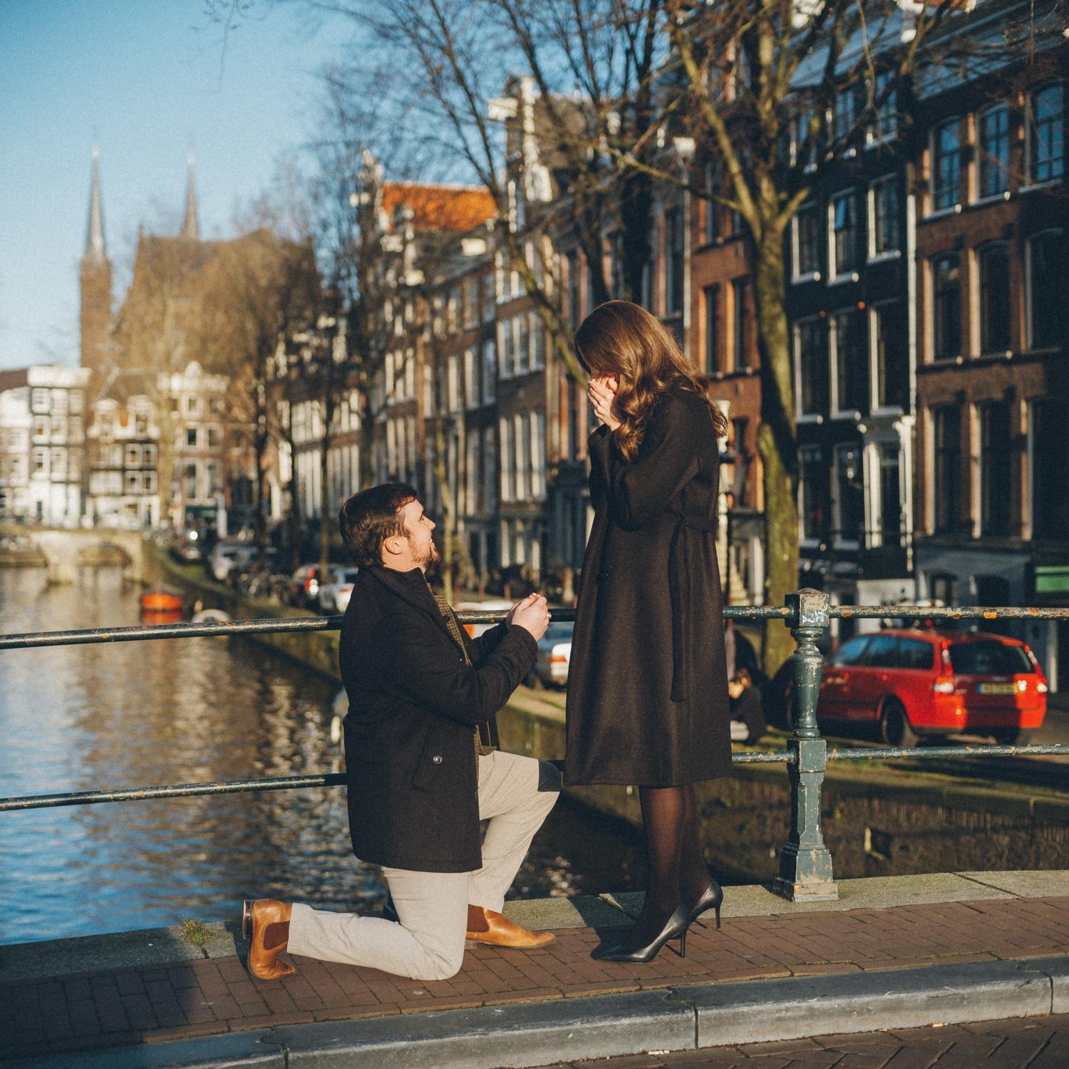 Grayson proposing in Amsterdam in March 2023 and surprising Lauren with a photographer there in hiding to capture the moment!