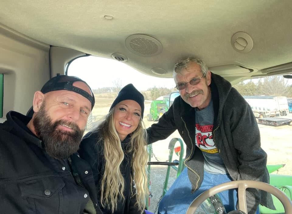 Dad, Steve and I in a John Deer.