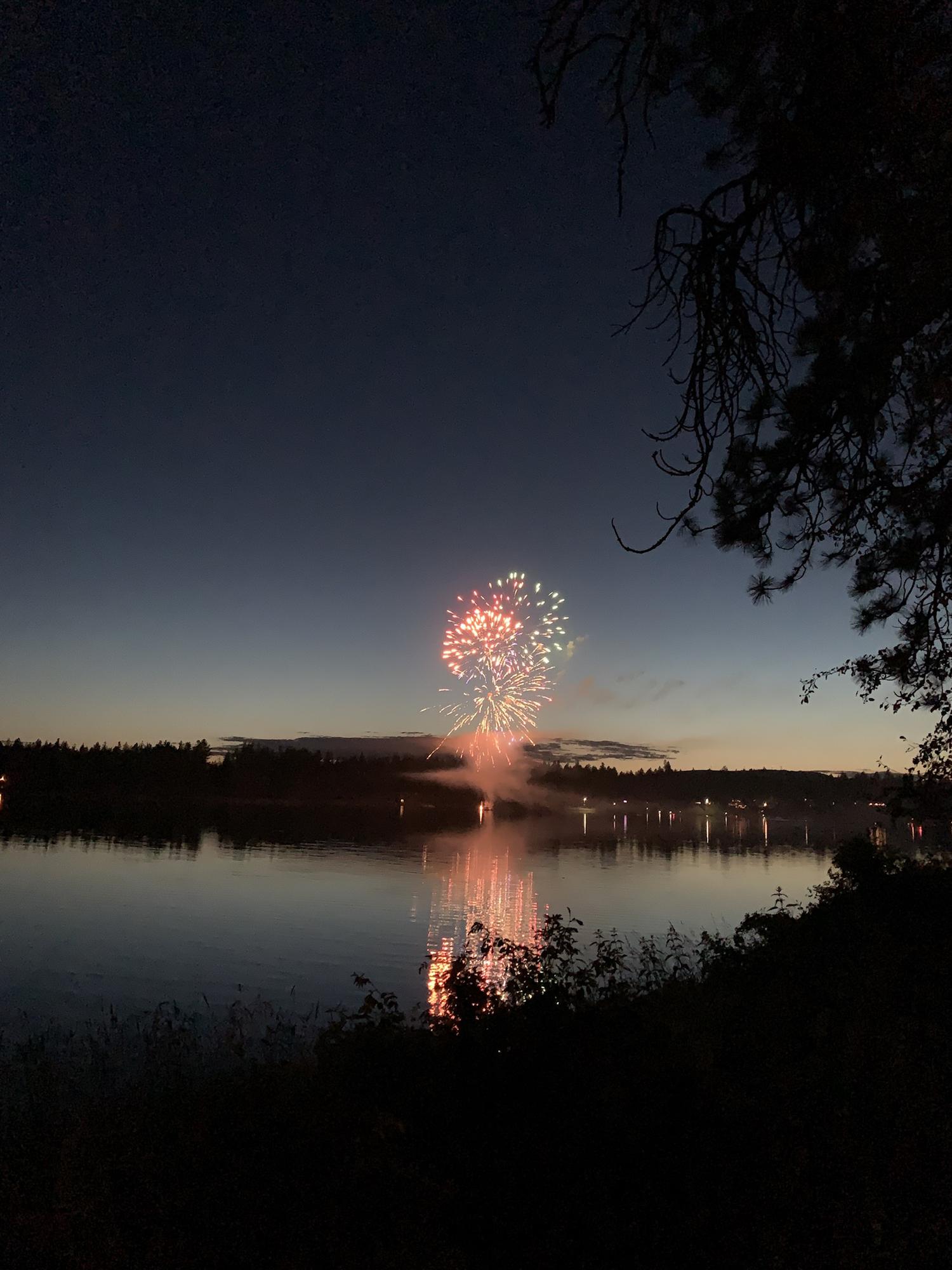Us enjoying 4th of July fireworks at our campsite by the lake