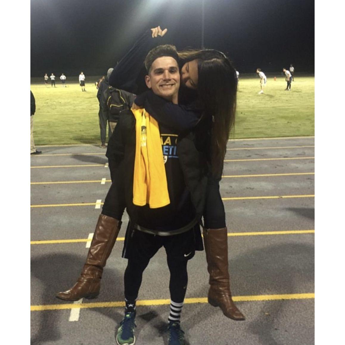 Mackey was the QB of his fraternity's football team and Camille cheered them on at every single game. This photo is after Sigma Chi won the championship!