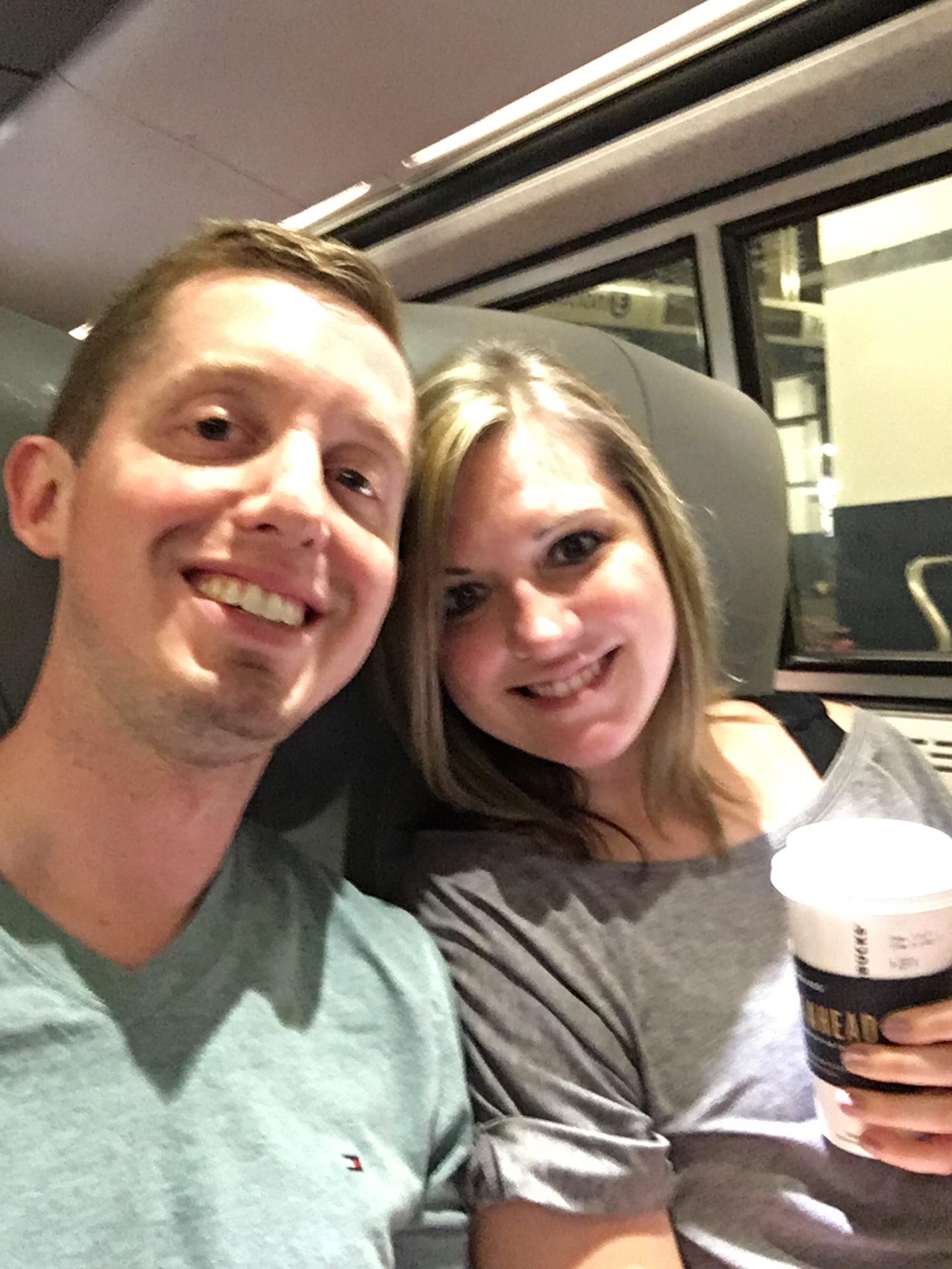 On the train to NYC, beyond happy and ready to celebrate our engagement.