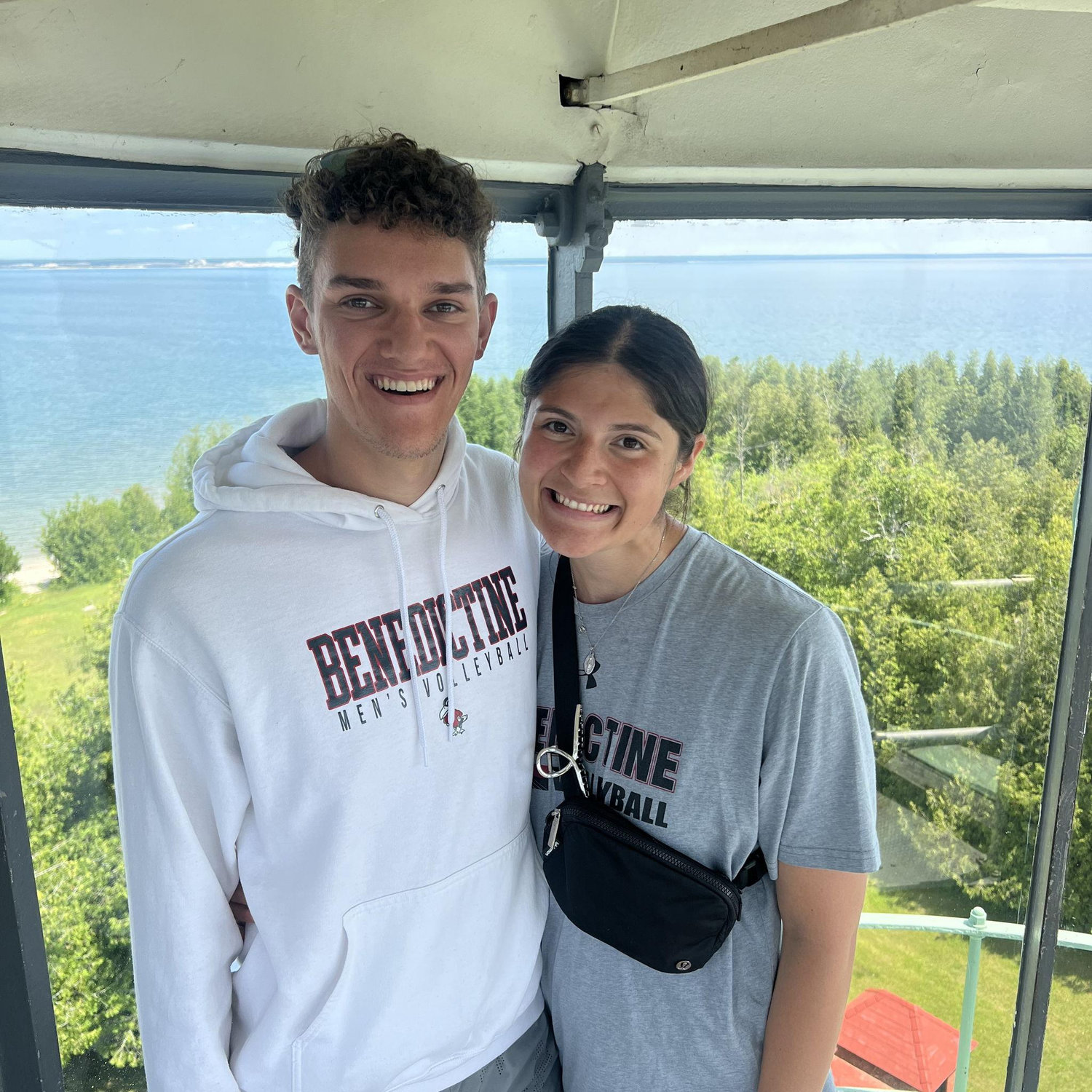 Us after hiking up lighthouse stairs in Michigan