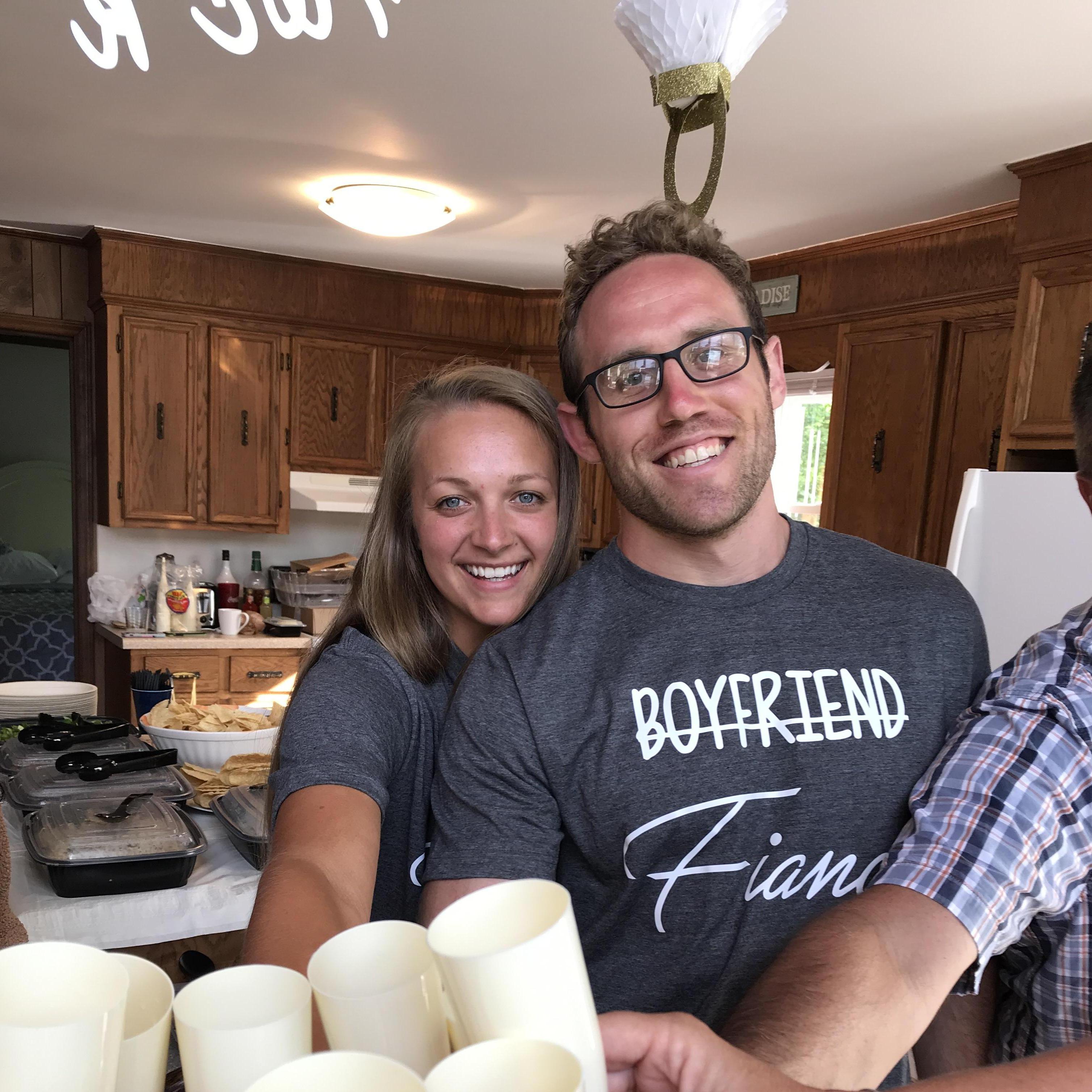 Showing off our matching shirts at our surprise engagement party on Lake Norman!