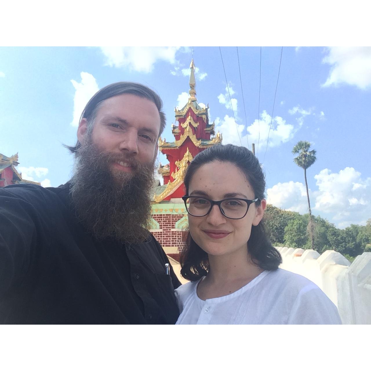 Can you tell we love to travel? This is us visiting a Buddhist temple in Myanmar, during a trip where we were staying at a monastery there
