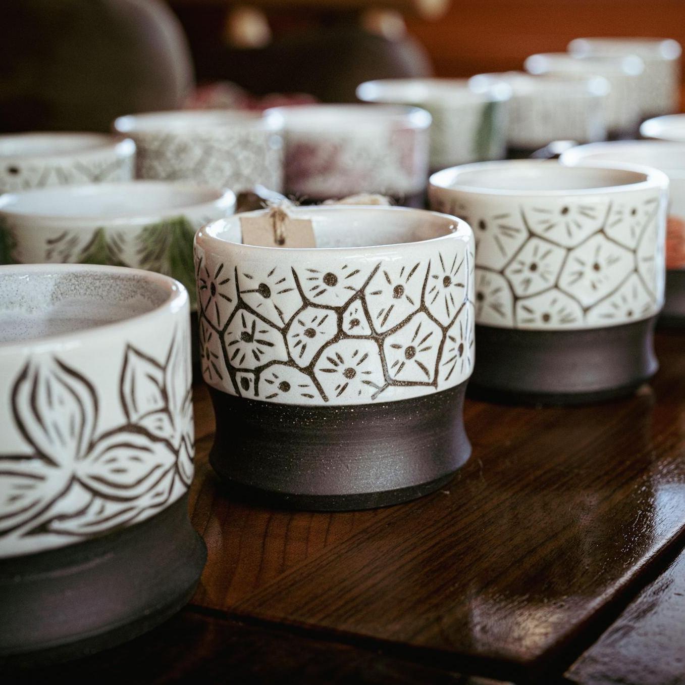 Custom mugs thrown by Chris & carved by Stassia for each guest.