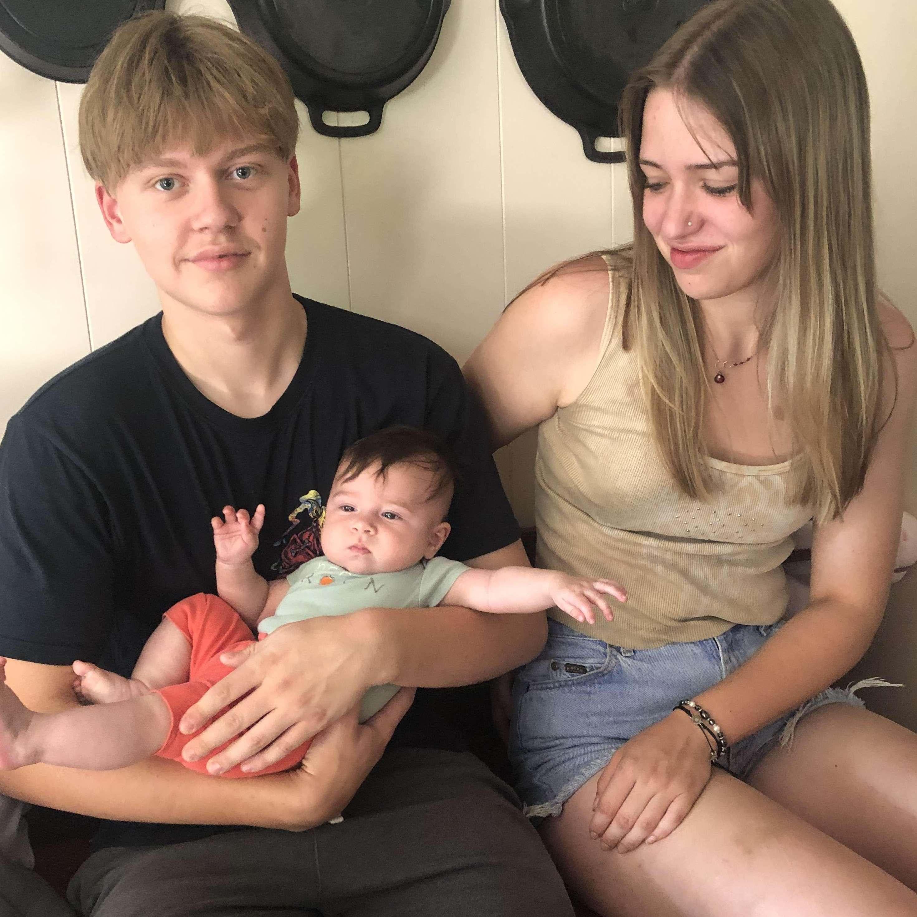 Erin and John holding Penelope