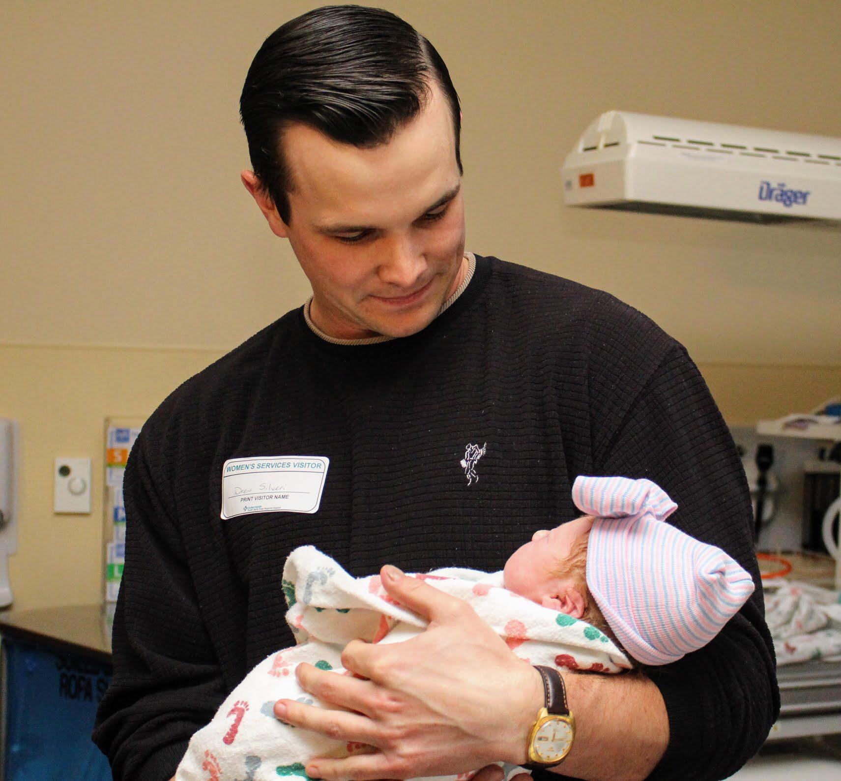 Holding the flower girl, Reese 4/16/19