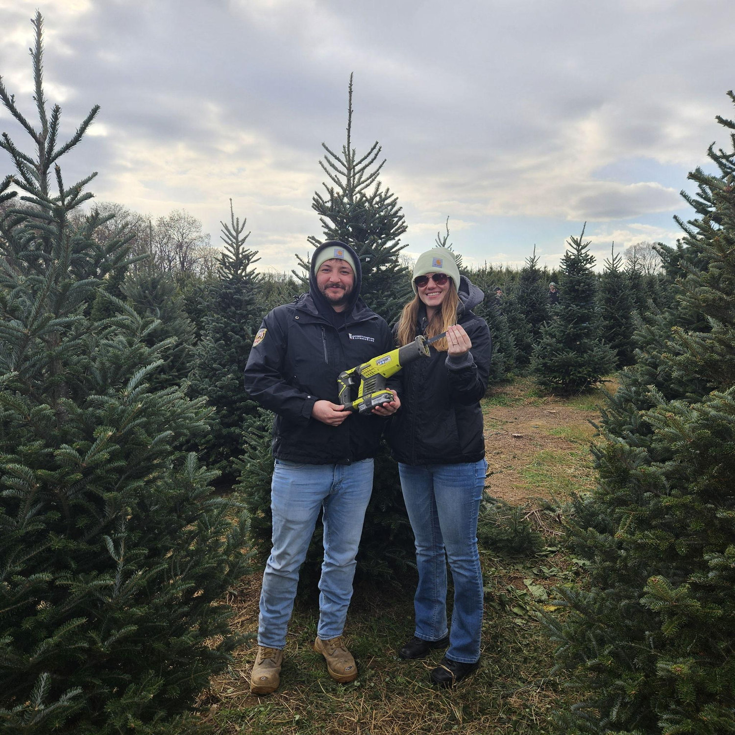 Cutting down our first live Christmas tree together. Jess' favorite part was getting to use power tools.