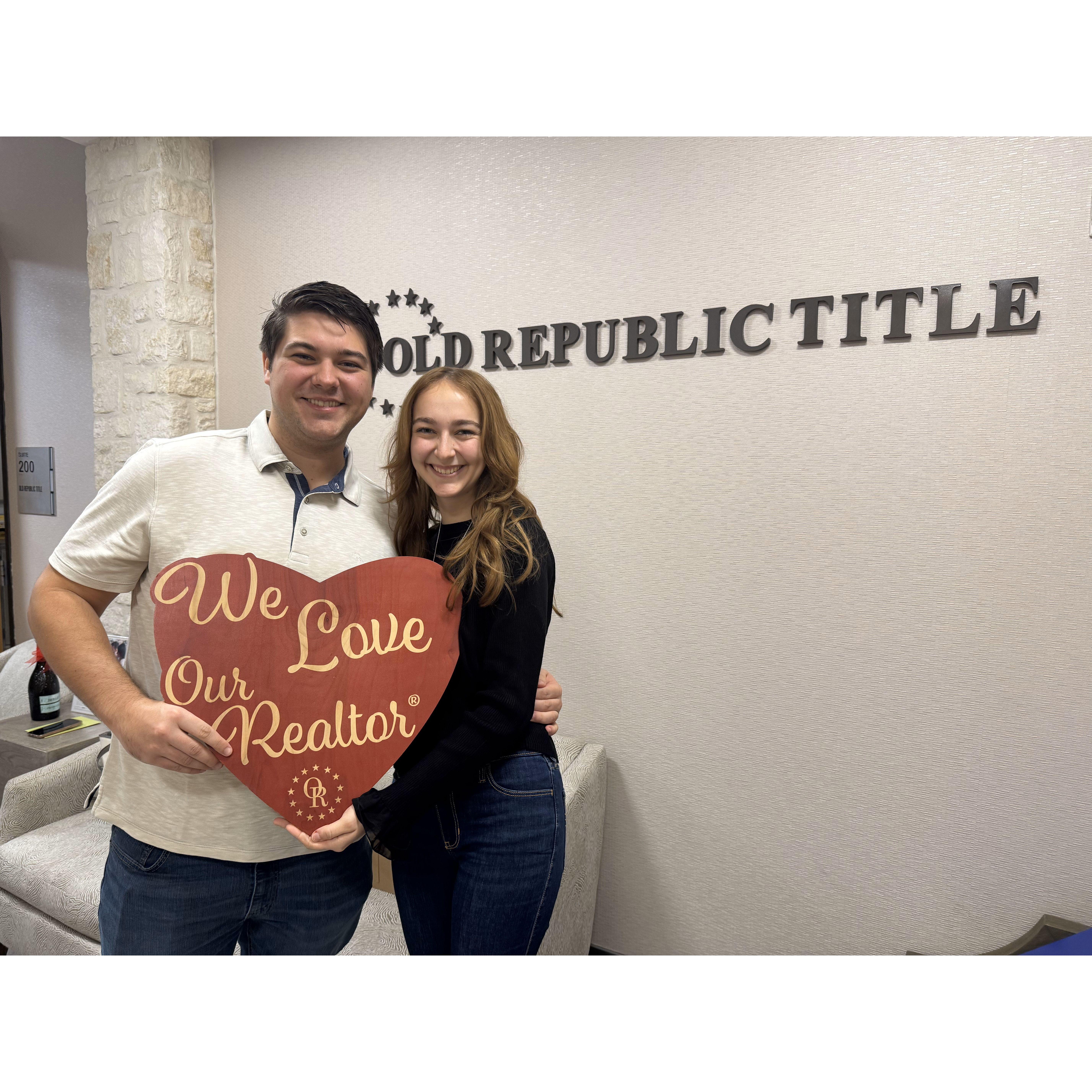 Us after signing the papers to buy our home