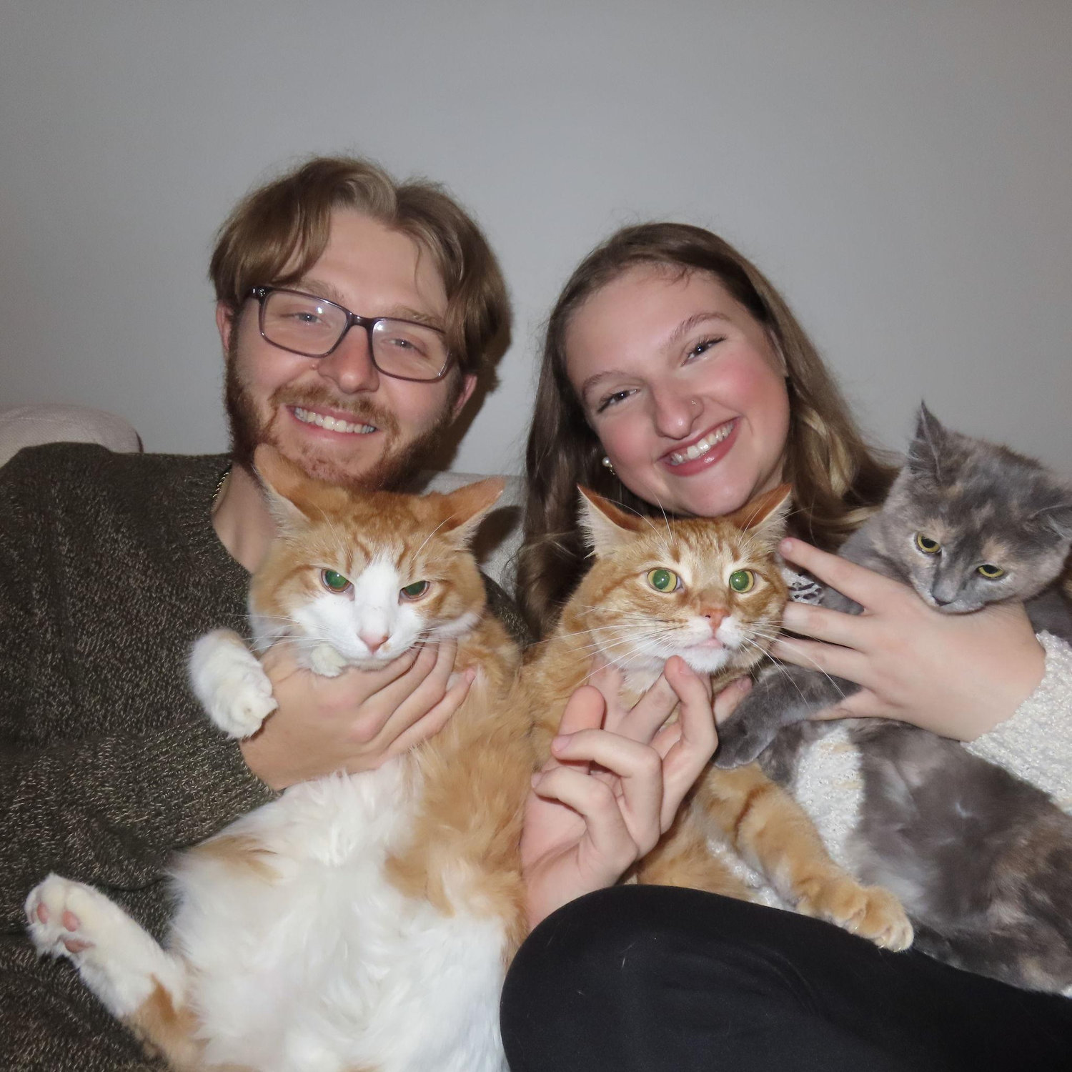 Kaleb and Madelyn with 3 of their 4 cats in December of 2024! (From L to R: Tobey, Alfie, Gracie)