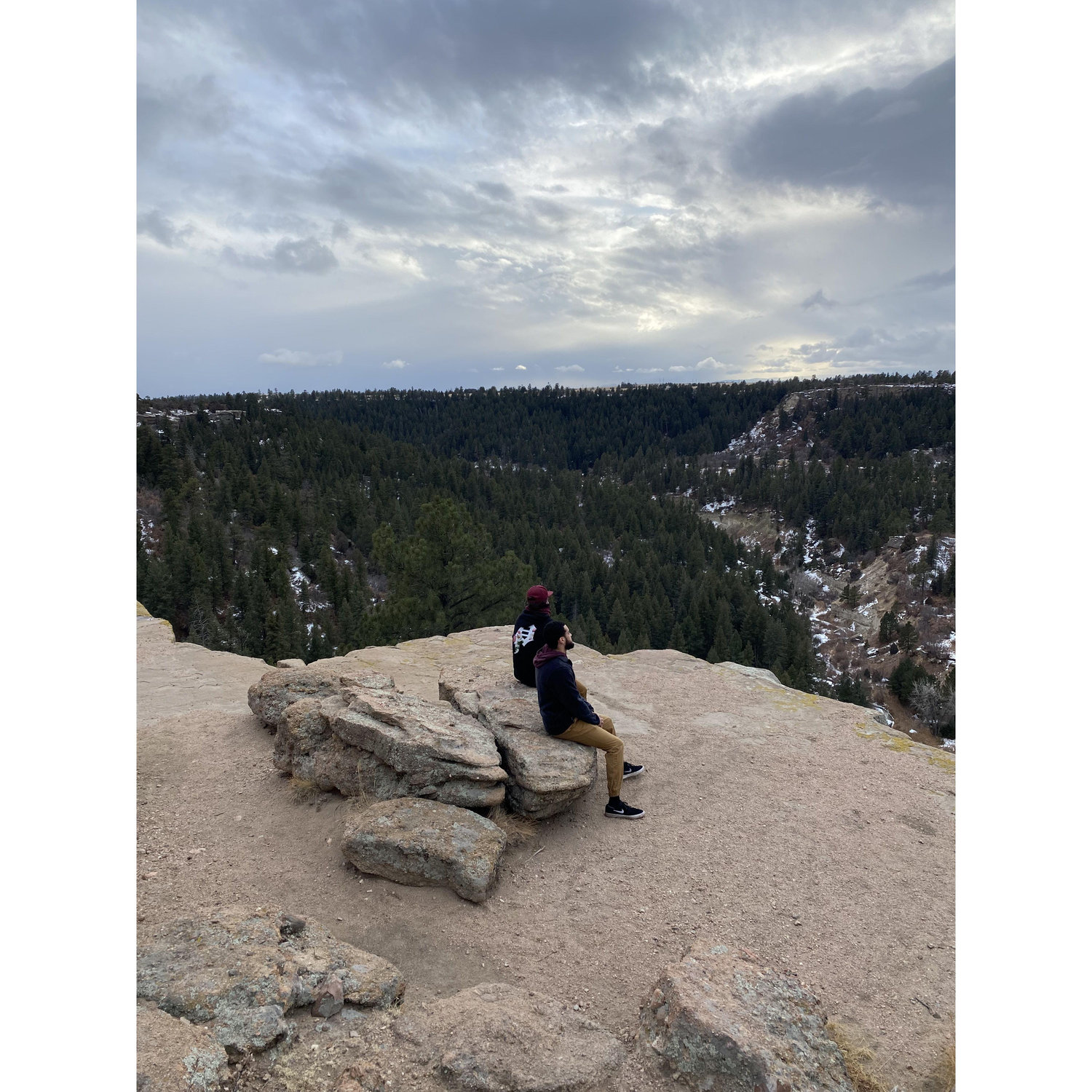 Jason and his best friend Trevor enjoying the peak of their hike.