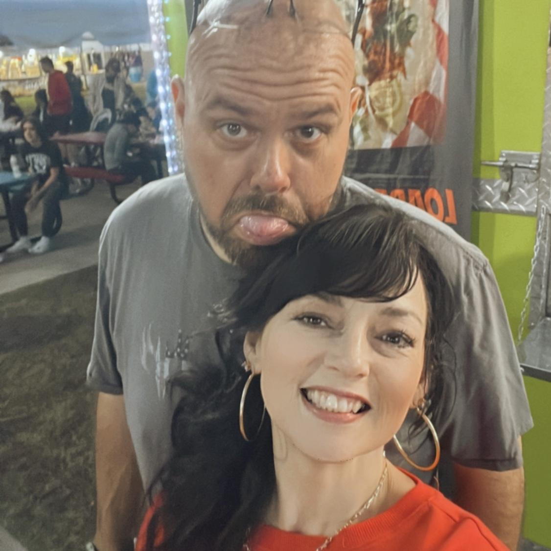 We stopped to take a picture while walking around the South Texas State Fair. This was a perfect night—fair food, rides, cuttin' up & holding hands.