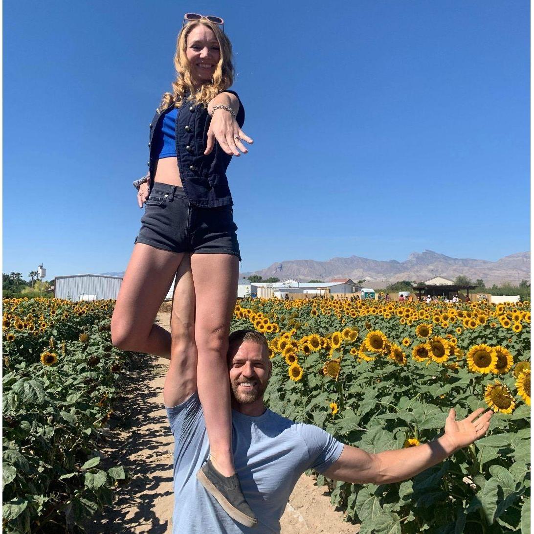 The proposal in a field of Veronica's favorite flower, the sunflower!