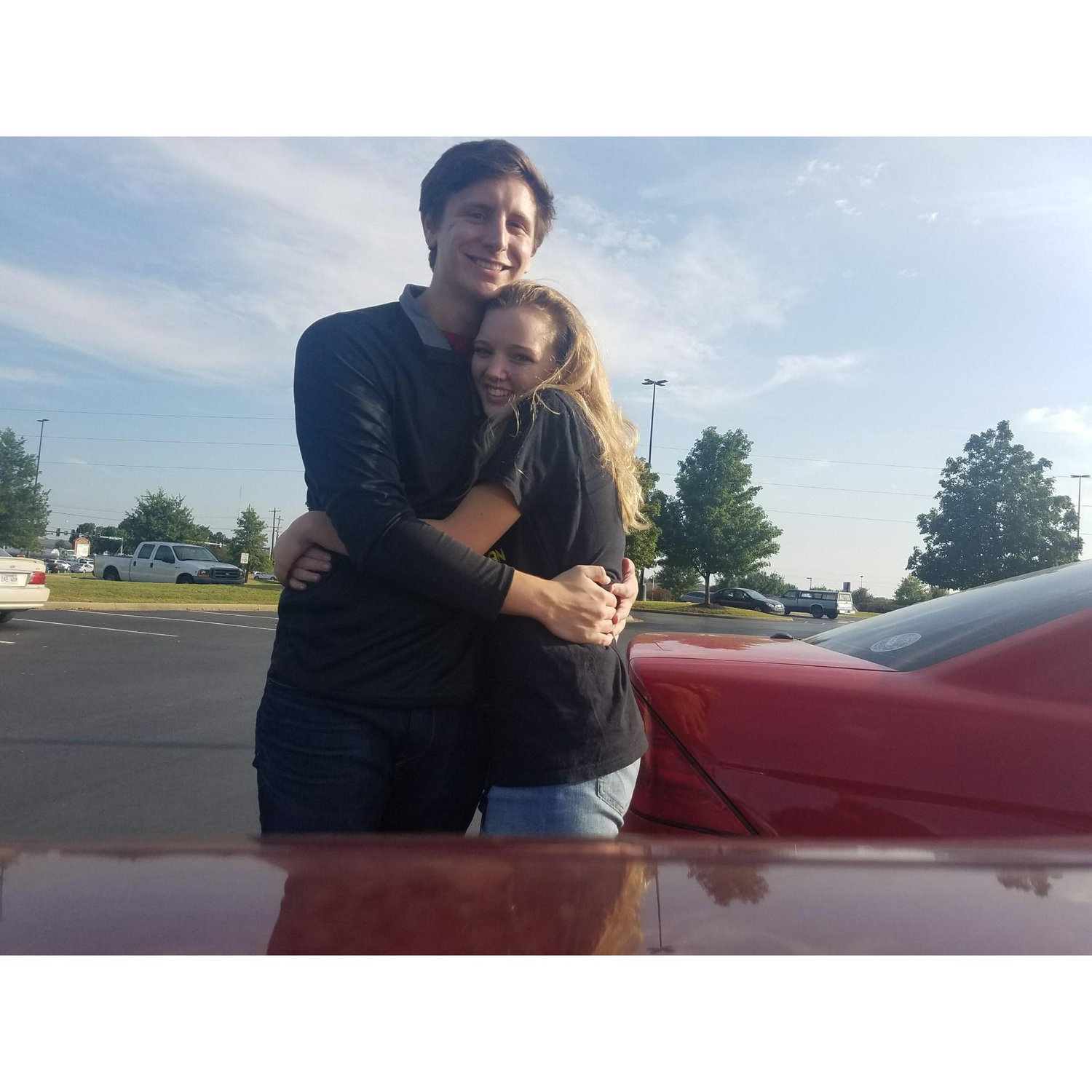 This picture was taken on our 1 year anniversary! Some back story: We don't take a lot of selfies, so we propped the phone on Brady's car and took the picture with a camera timer! It's a sweet memory!
