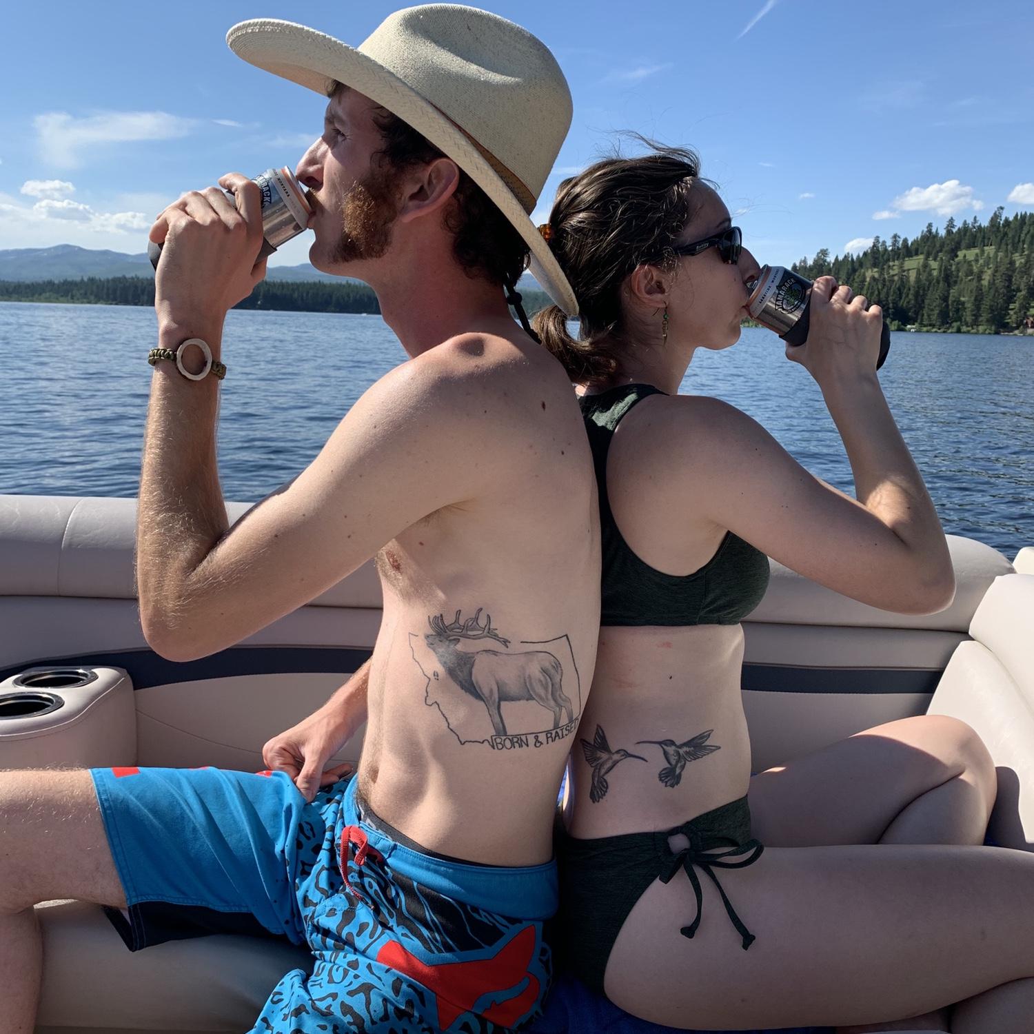 Enjoying a drink on the pontoon boat at Placid Lake. June 2020