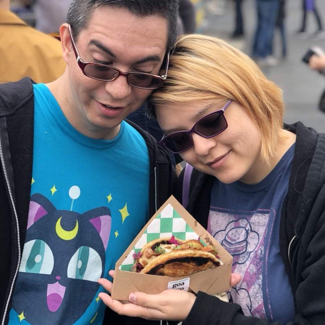 Looking longingly at a meal at an outdoor food festival.