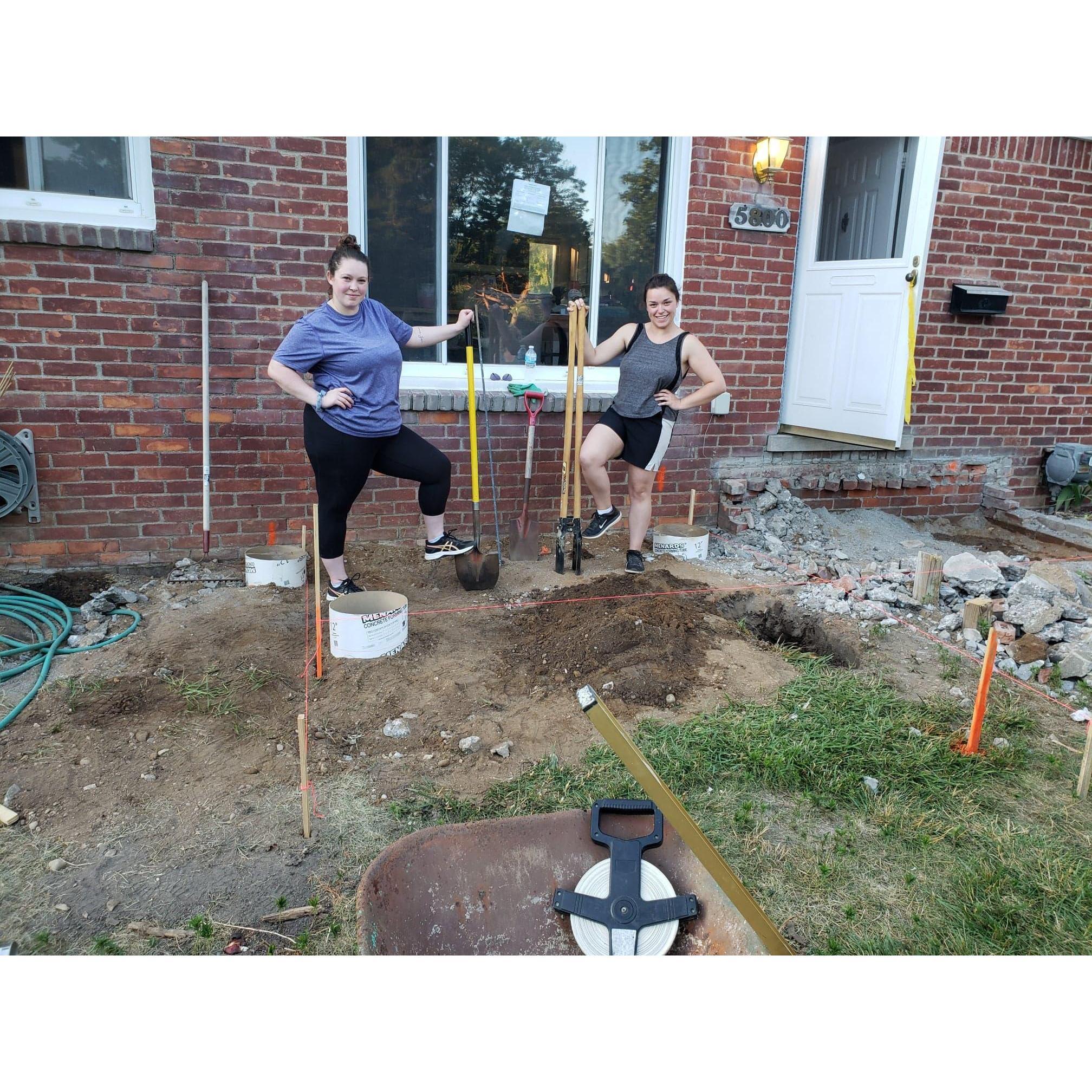 Katie and Jessi putting in some posts for the new front porch!