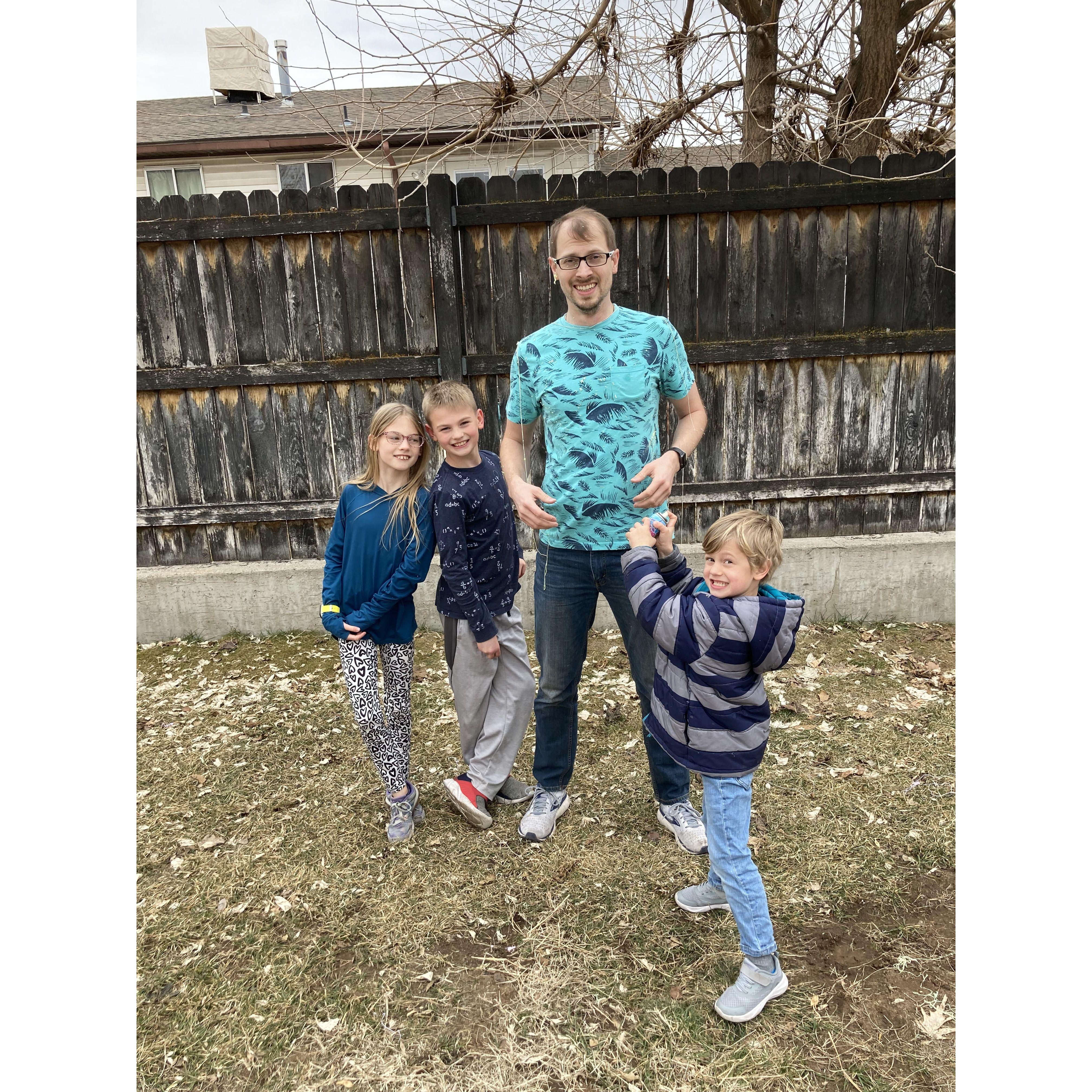 Jackie organized a silly string fight with the kids against Adam.