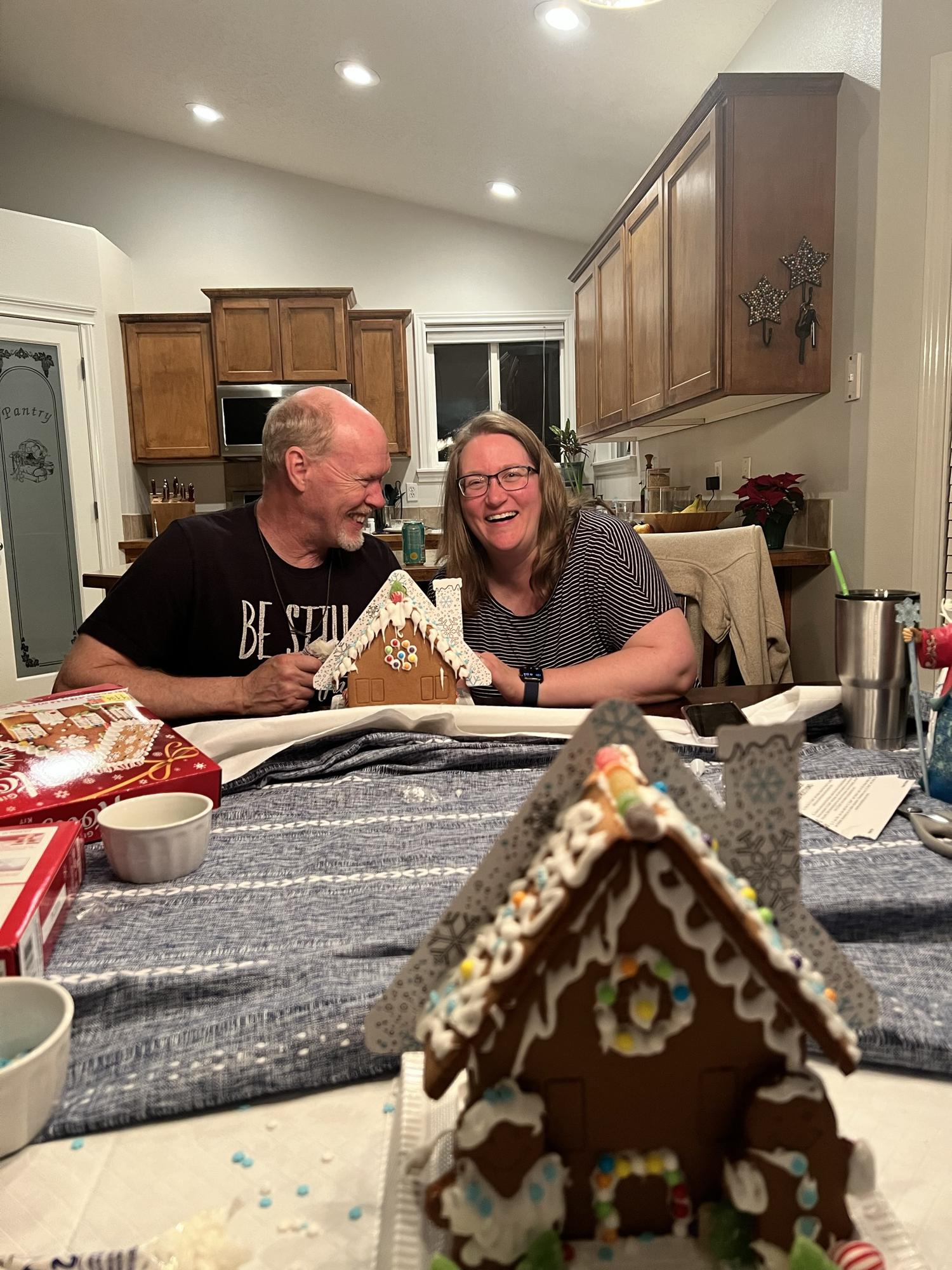 Decorated gingerbread houses with the parents