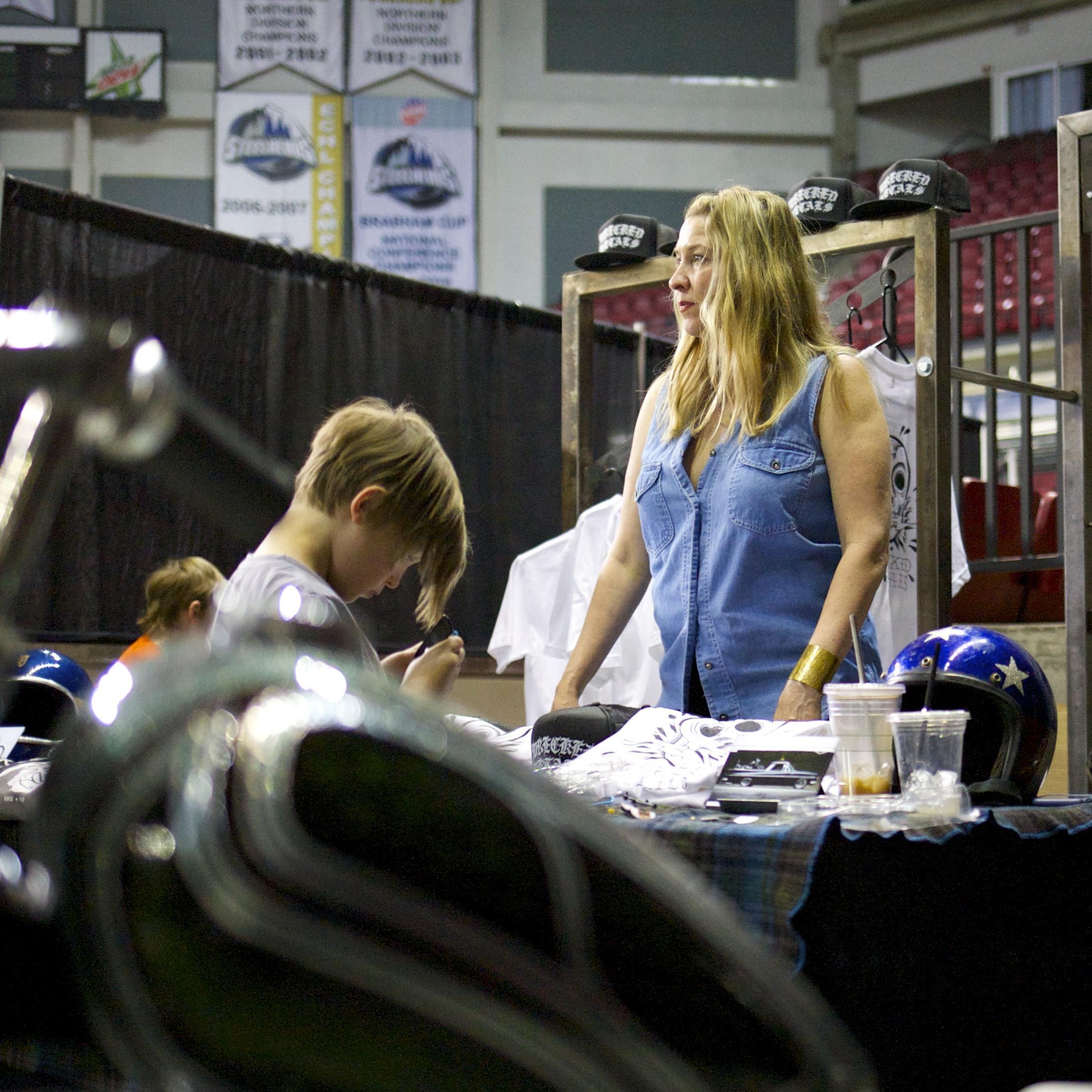 Zeke and Kellie selling shirts at the tattoo festival.