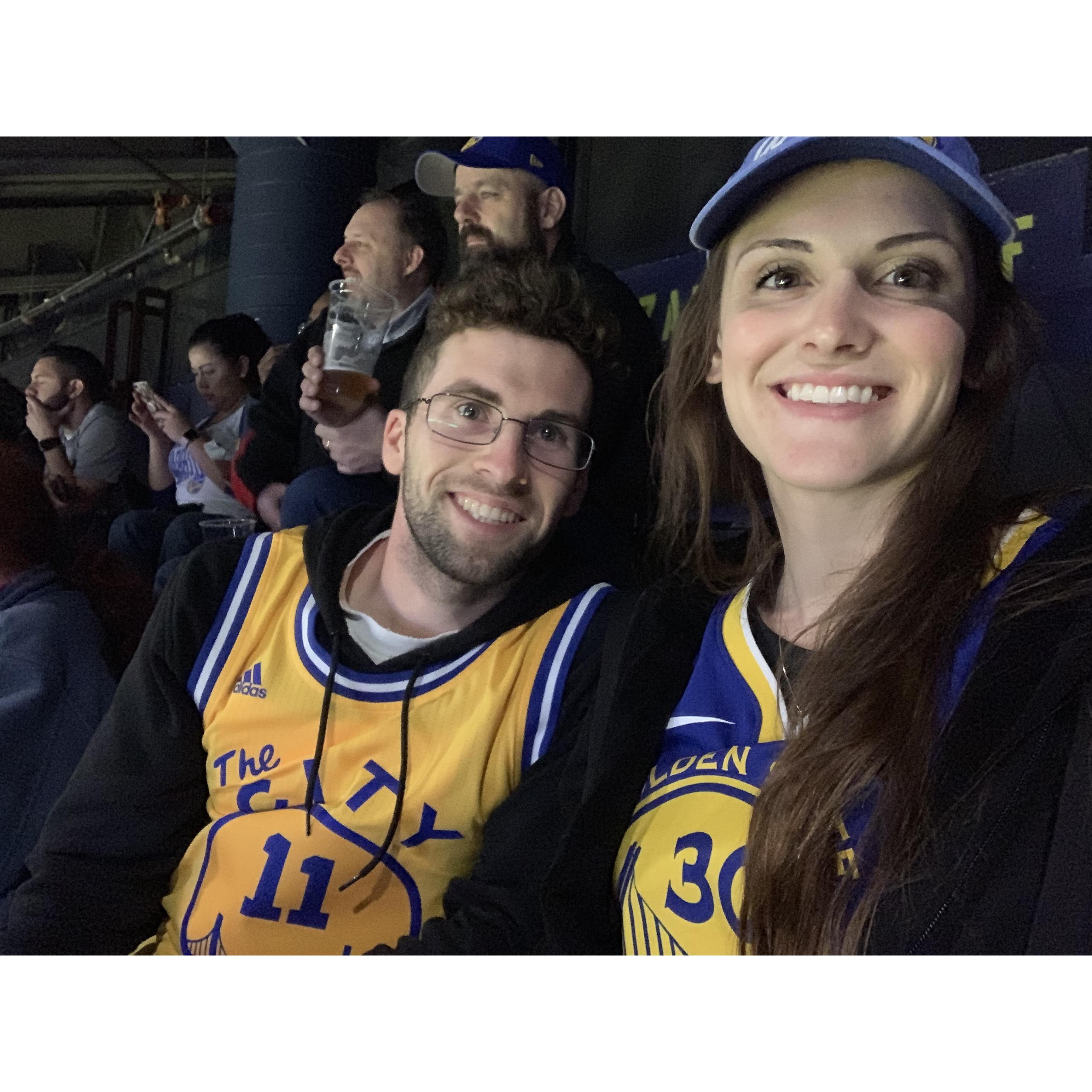 Ang and Kyle at a Warriors game.