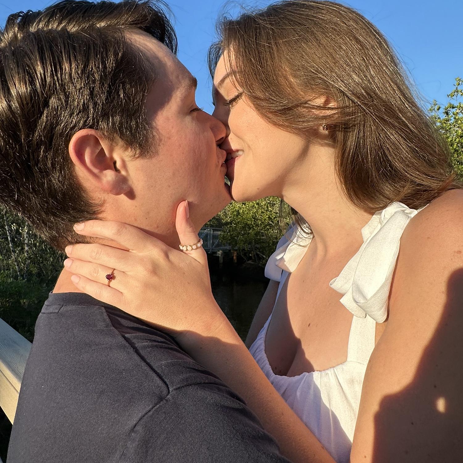 A golden hour kiss in Hammock Park, right near our chapel we'll be getting married at!