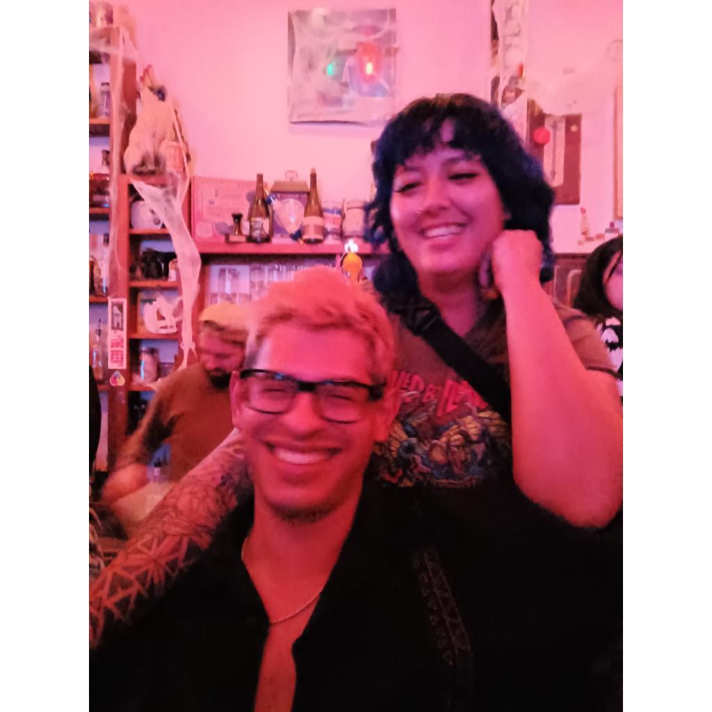 Us at Stamp, the local punk bar, where we first met. Spring 2024