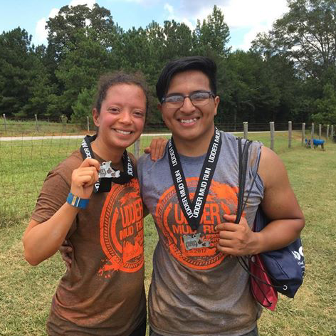 A mud obstacle race we completed together in 2017! (Don't be fooled Sergio showered before this picture)