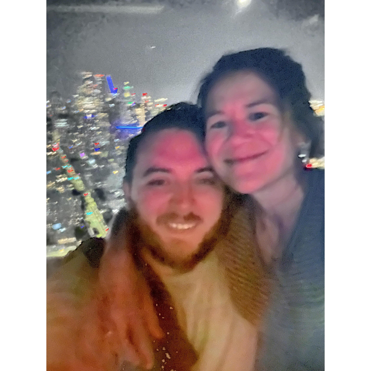 At the top of the space needle, the last night of the trip when we got engaged.