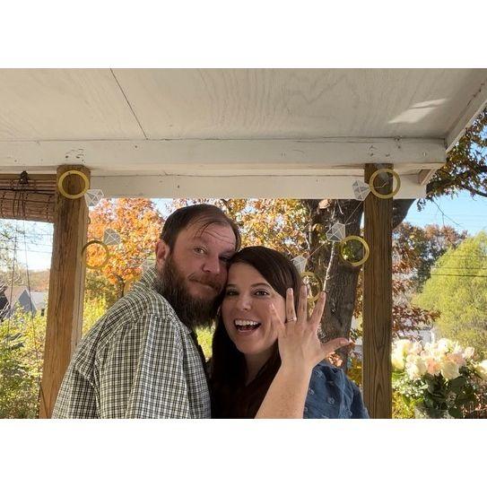 Engaged!! November 1, 2022 on our deck where we love to sit and chat while our dog, Bert plays in the backyard. Perfect moment
