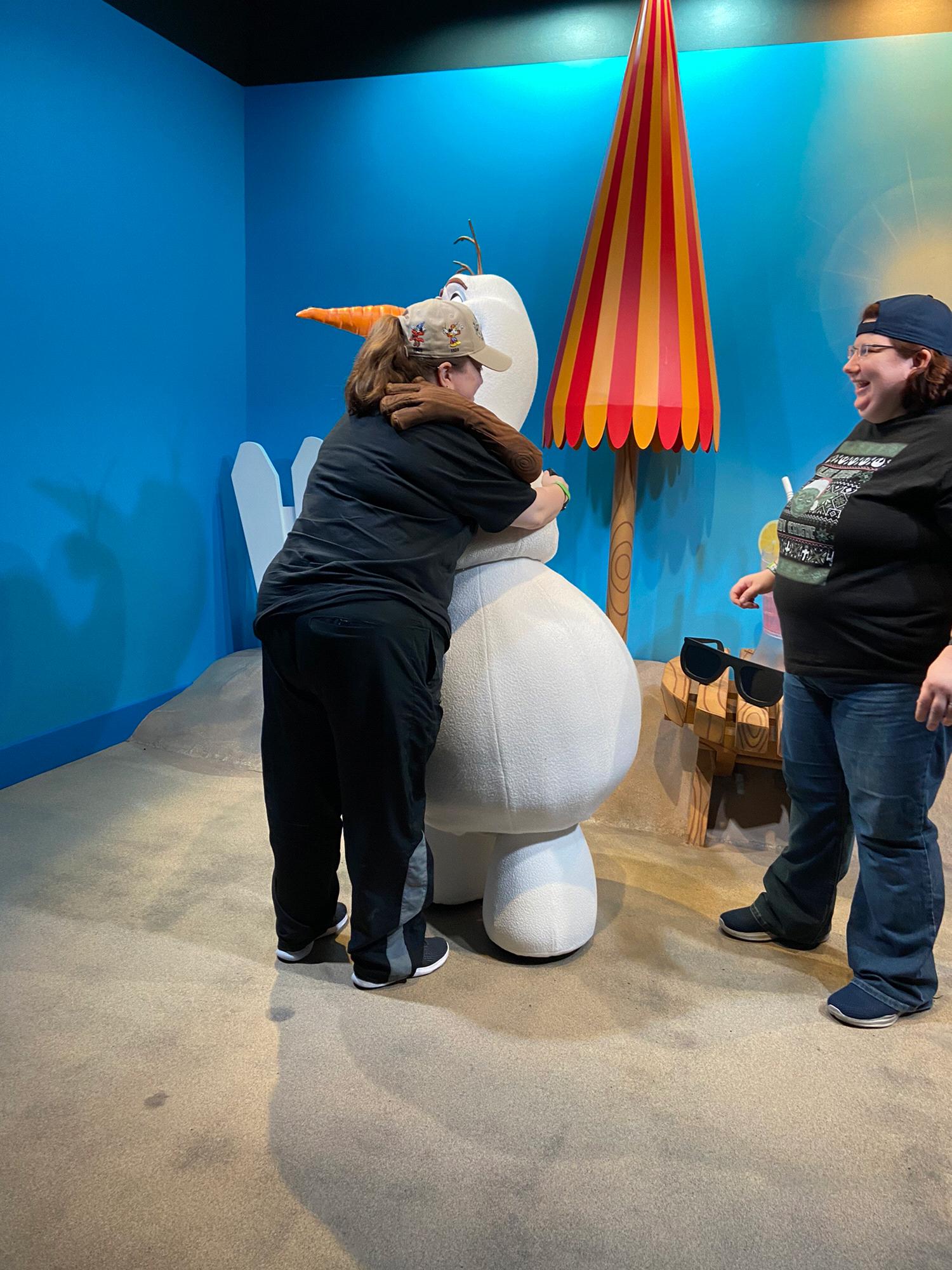 Trish getting a warm hug from Olaf at Disney World