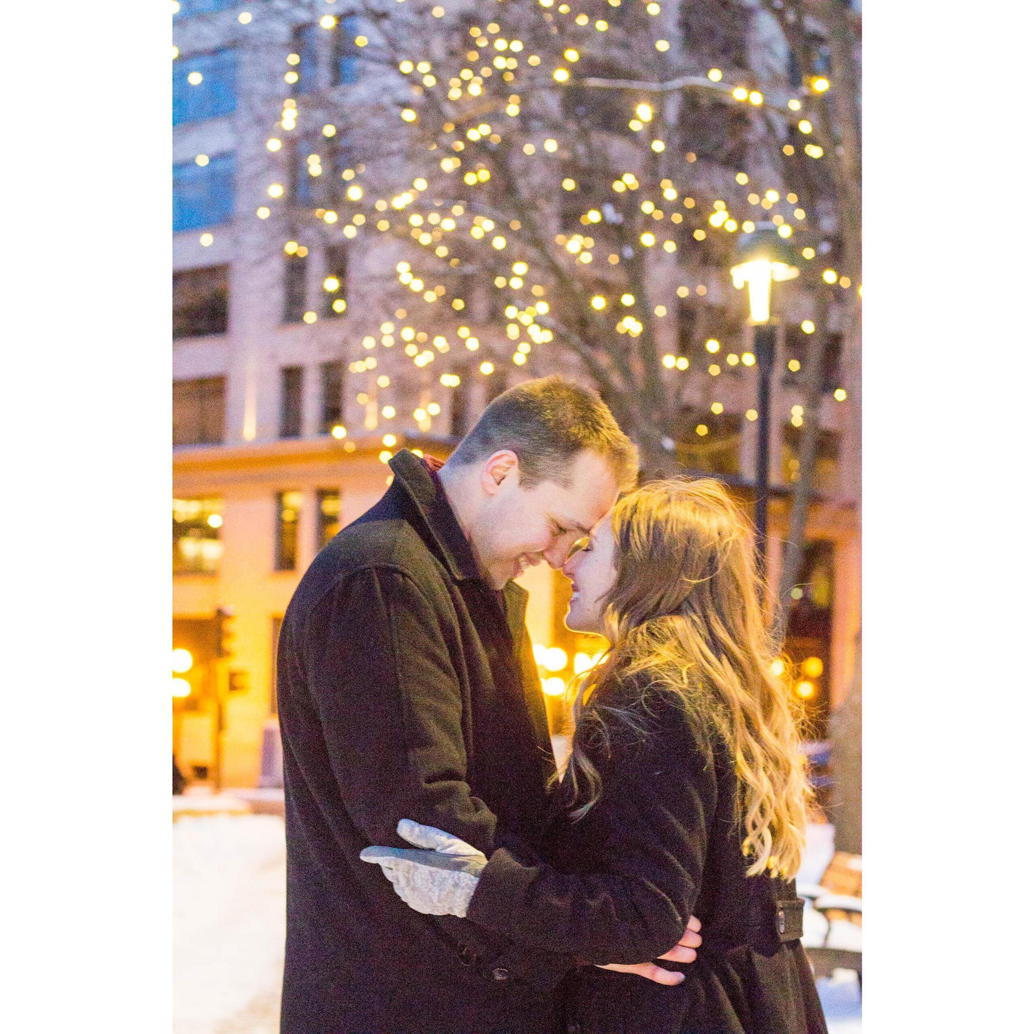 Posing for our 2019 engagement photos in Mears Park, near where we met outside my apartment seven years before.