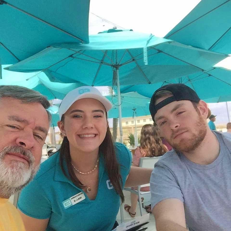 Jim (Jake's dad) and Jake visiting K-Lani at her serving job at Casino Beach, 2022