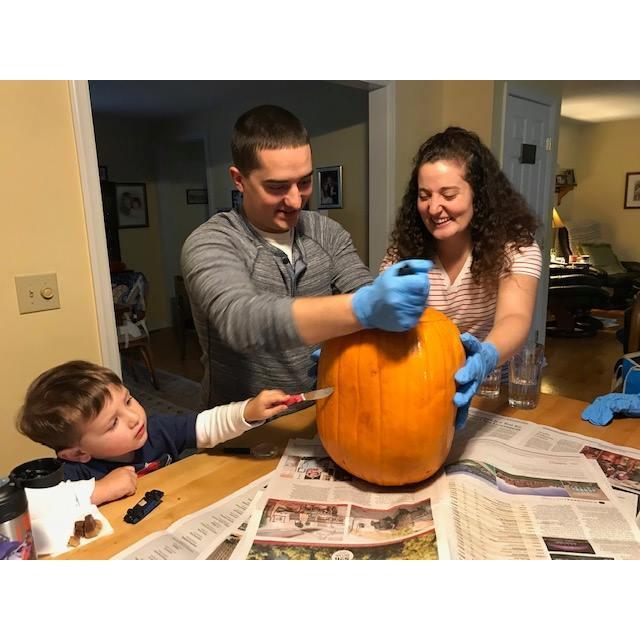 Carving a pumpkin with our nephew, Alex!