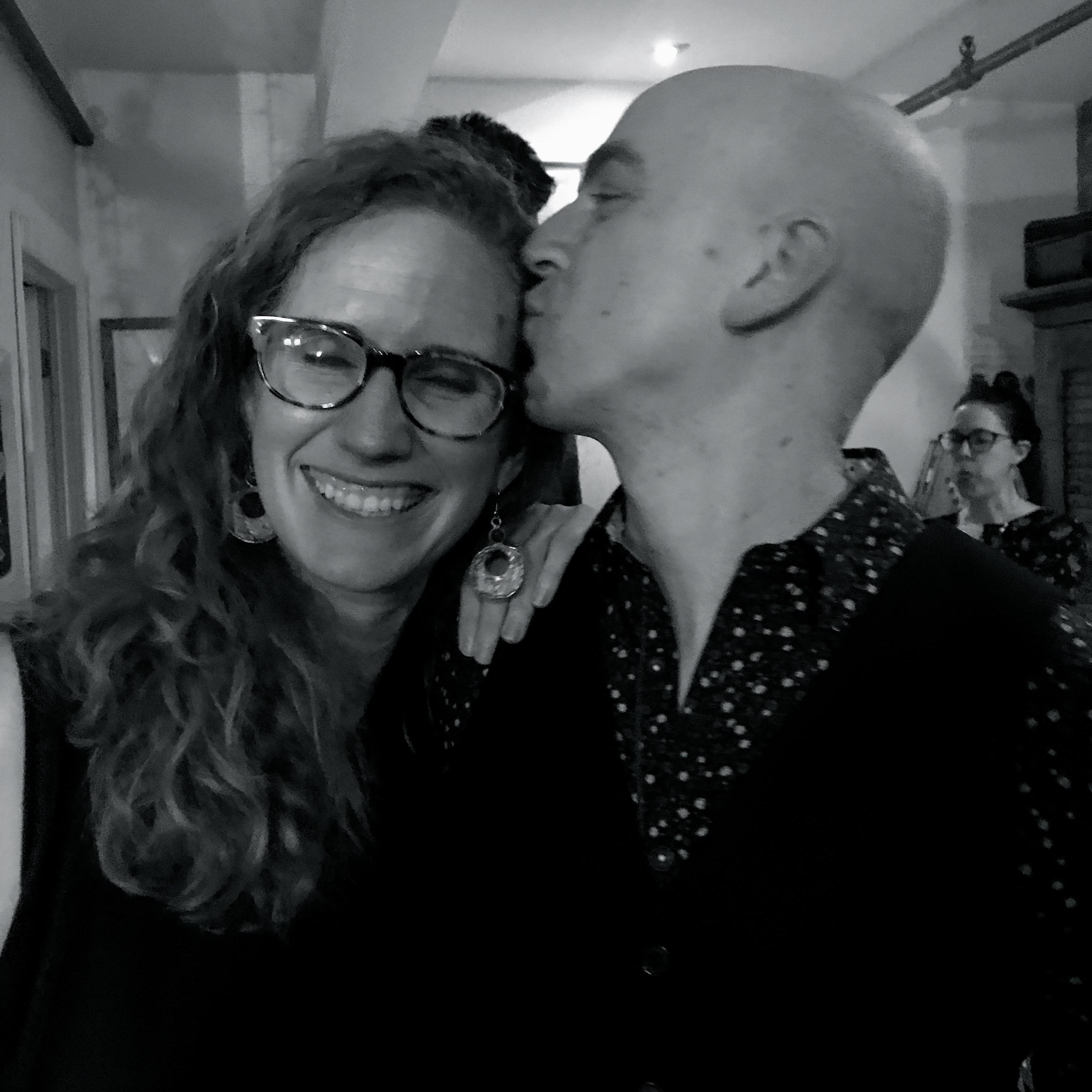 The one with glasses is the bride, and the baldie is the groom.