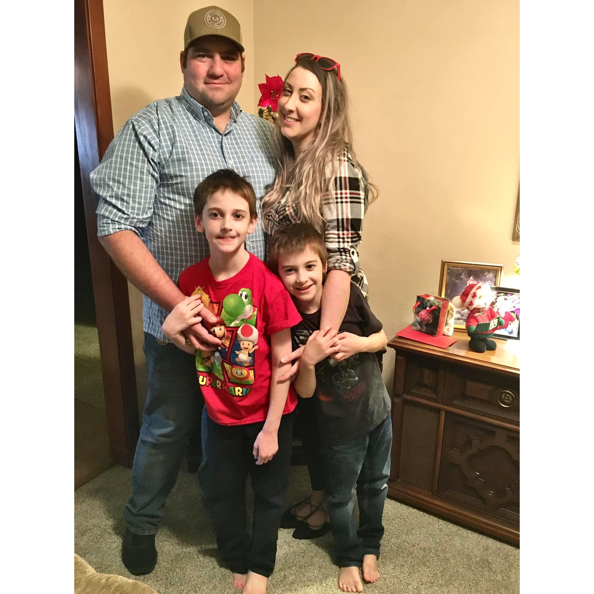First posed family photo, in front of the tiny Christmas tree at Kathryn's grandma's house. That's when you know you're in!