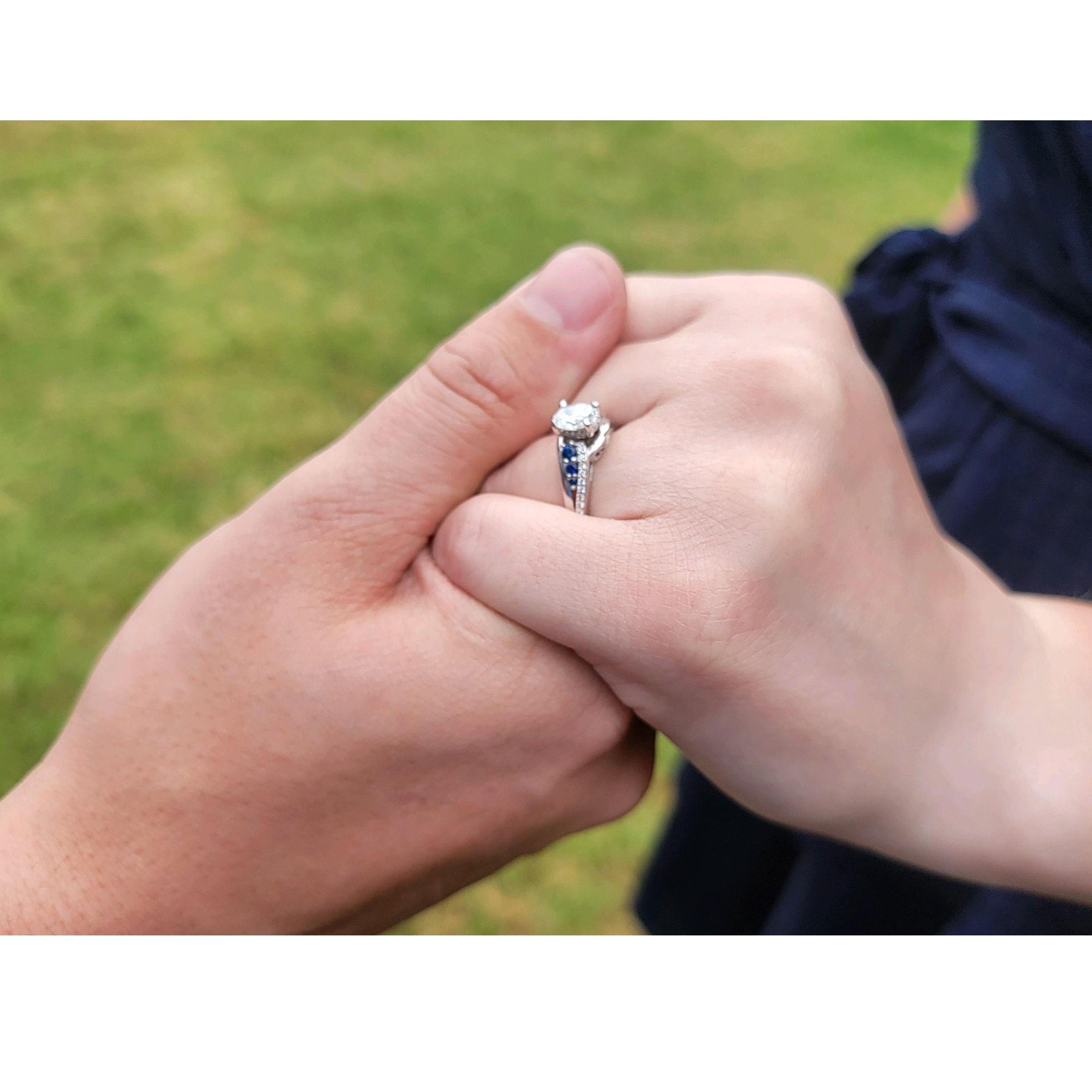 Taylor's dad took a picture of them holding hands the week after they got engaged.