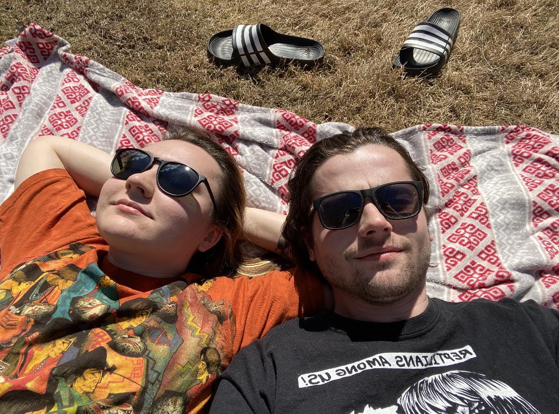 Chilling in the sun outside our first (very sketchy) apartment together