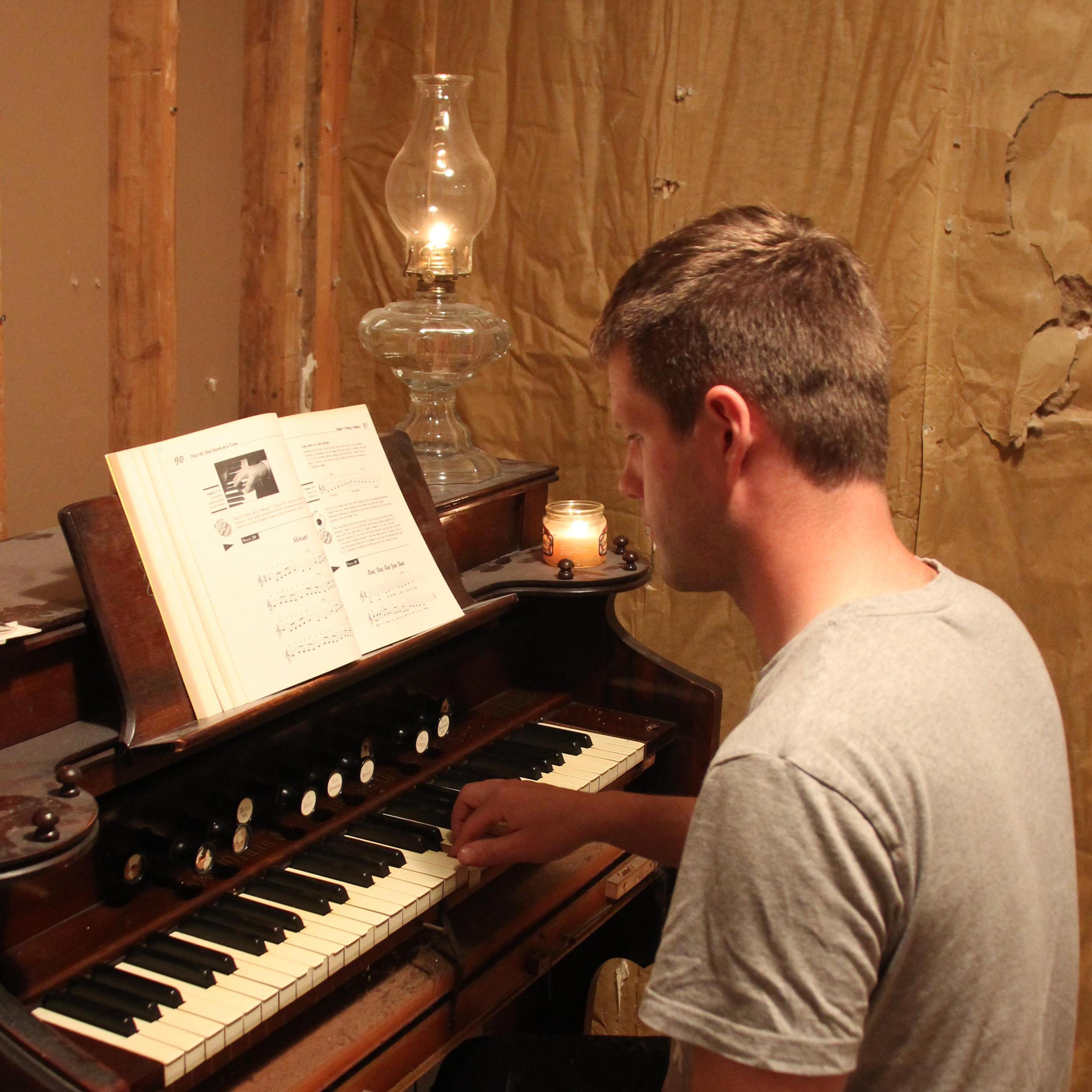 Tickling the ivory of the old organ.