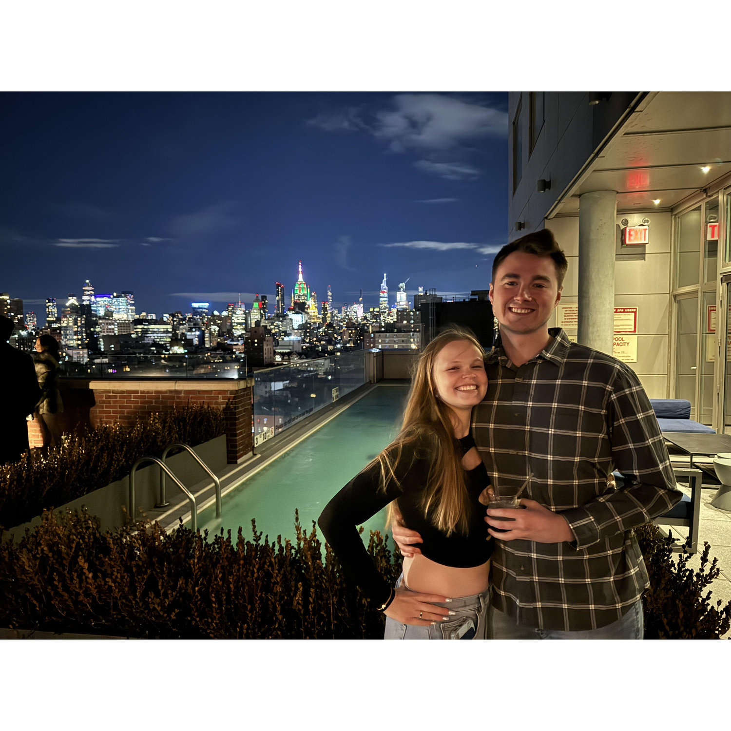 Margaux and Austin with the New York City skyline.