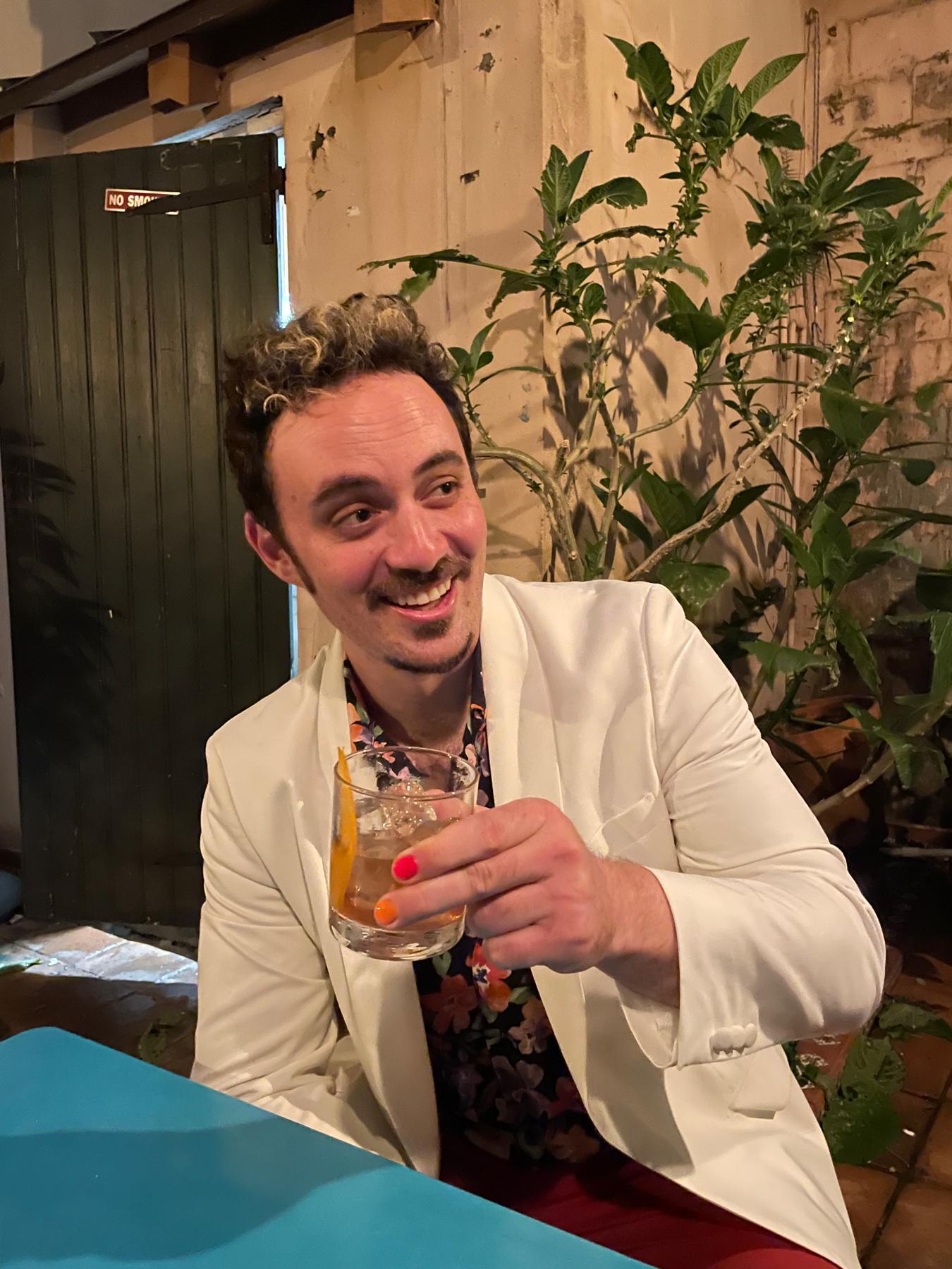 Dave drinking a cocktail in New Orleans