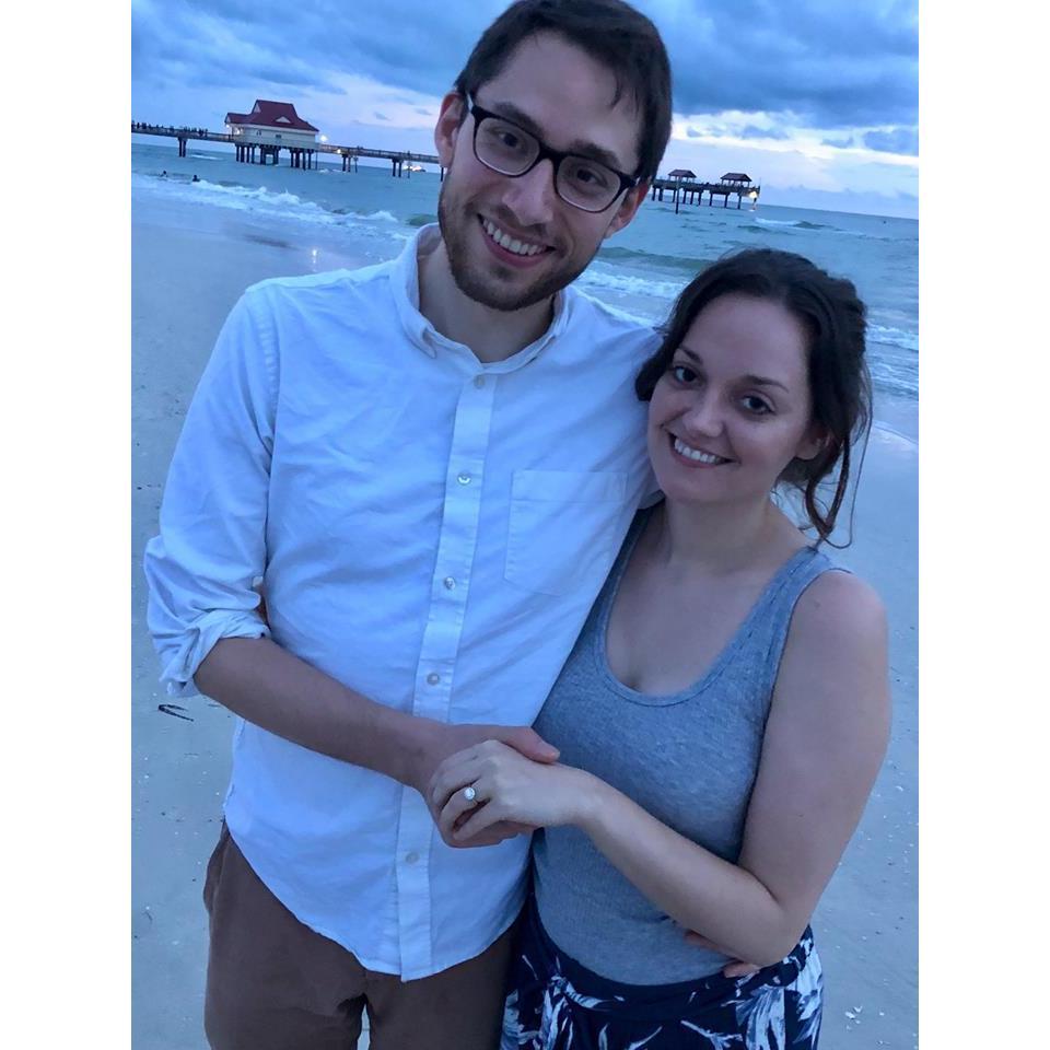 At the beach at our favorite vacation spot in Clearwater FL, right after sharing our engagement news with Kristen's parents.
