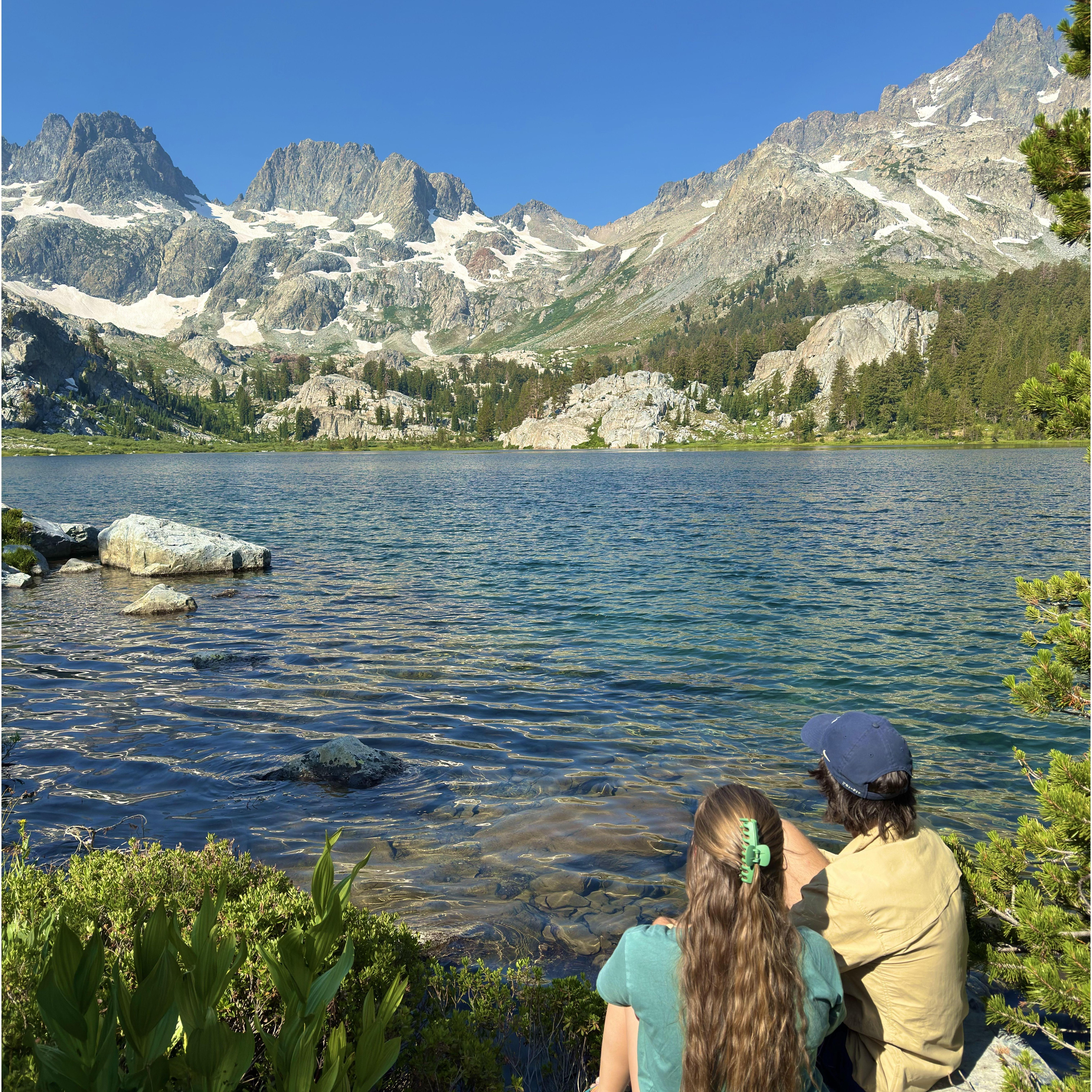 Taking a moment on the shore of the lake we backpacked to for our engagement