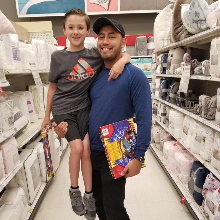 Getting spoiled down the Target aisle. Their smiles...hehe.