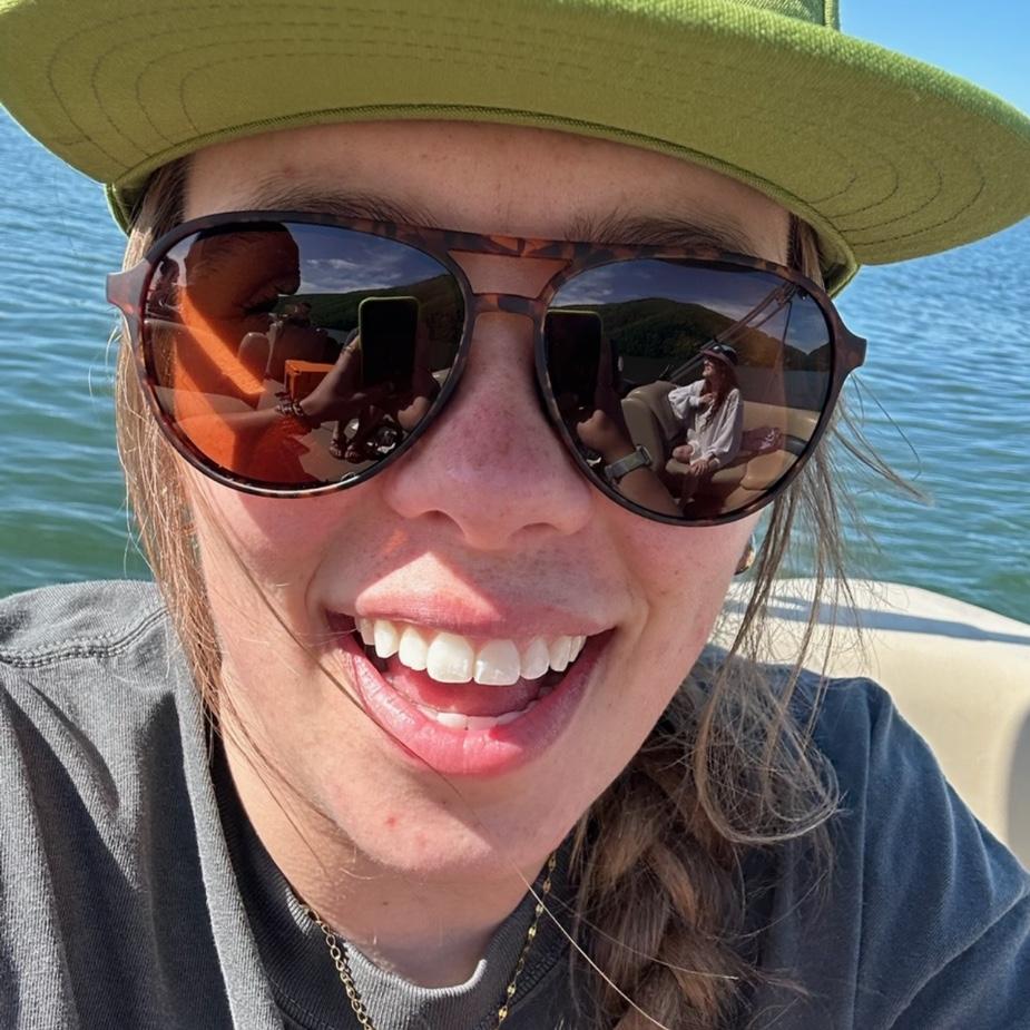 Julia on Carson's families boat after he invited her friends and her after the class trip!